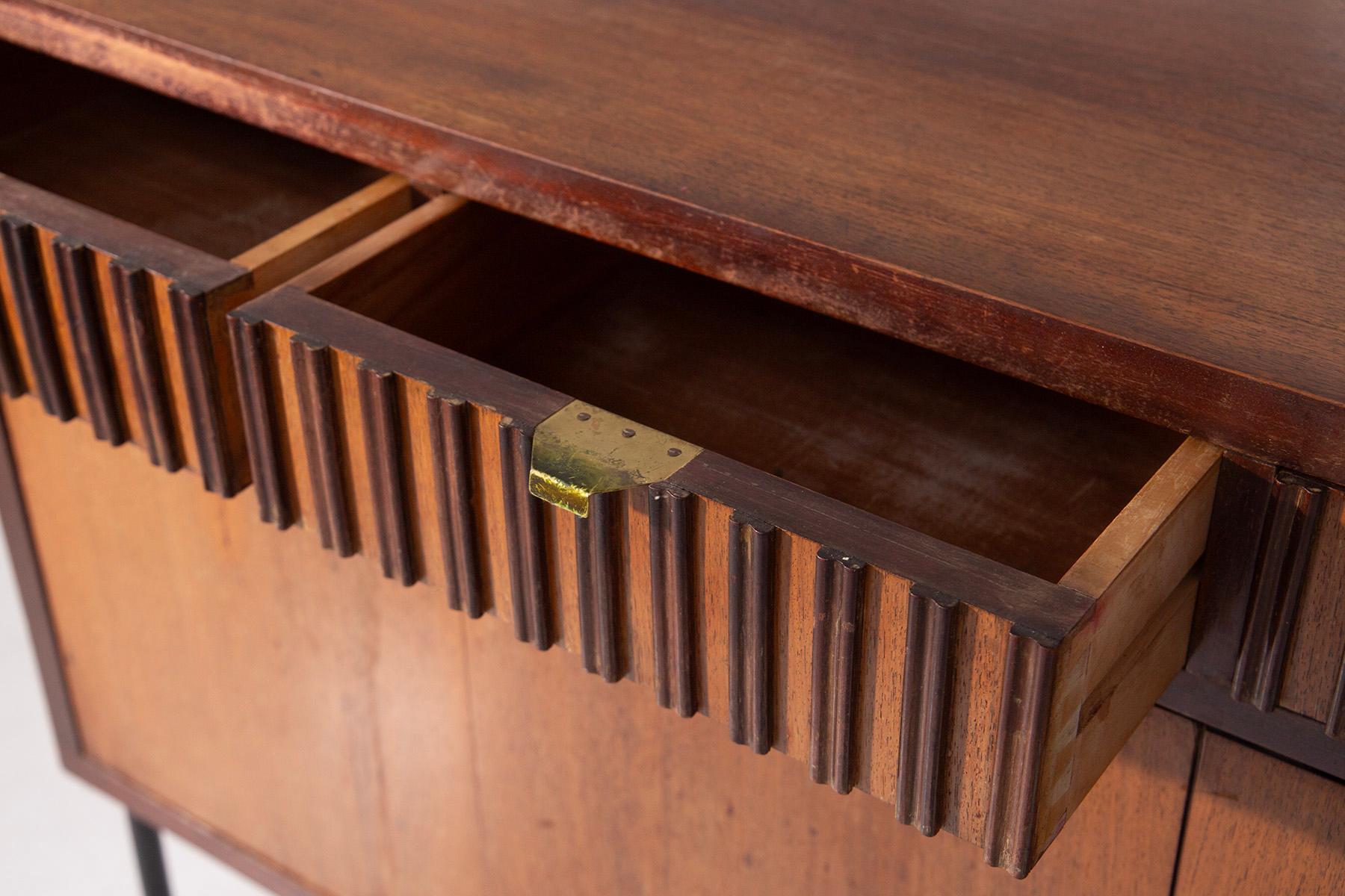 A rare gem of mid-century Italian design, this sideboard designed by the 1940s studio B.B.P.R embodies the craftsmanship and timeless elegance of Italian modernism. Every detail tells a story of care and innovation: the four understated wooden doors