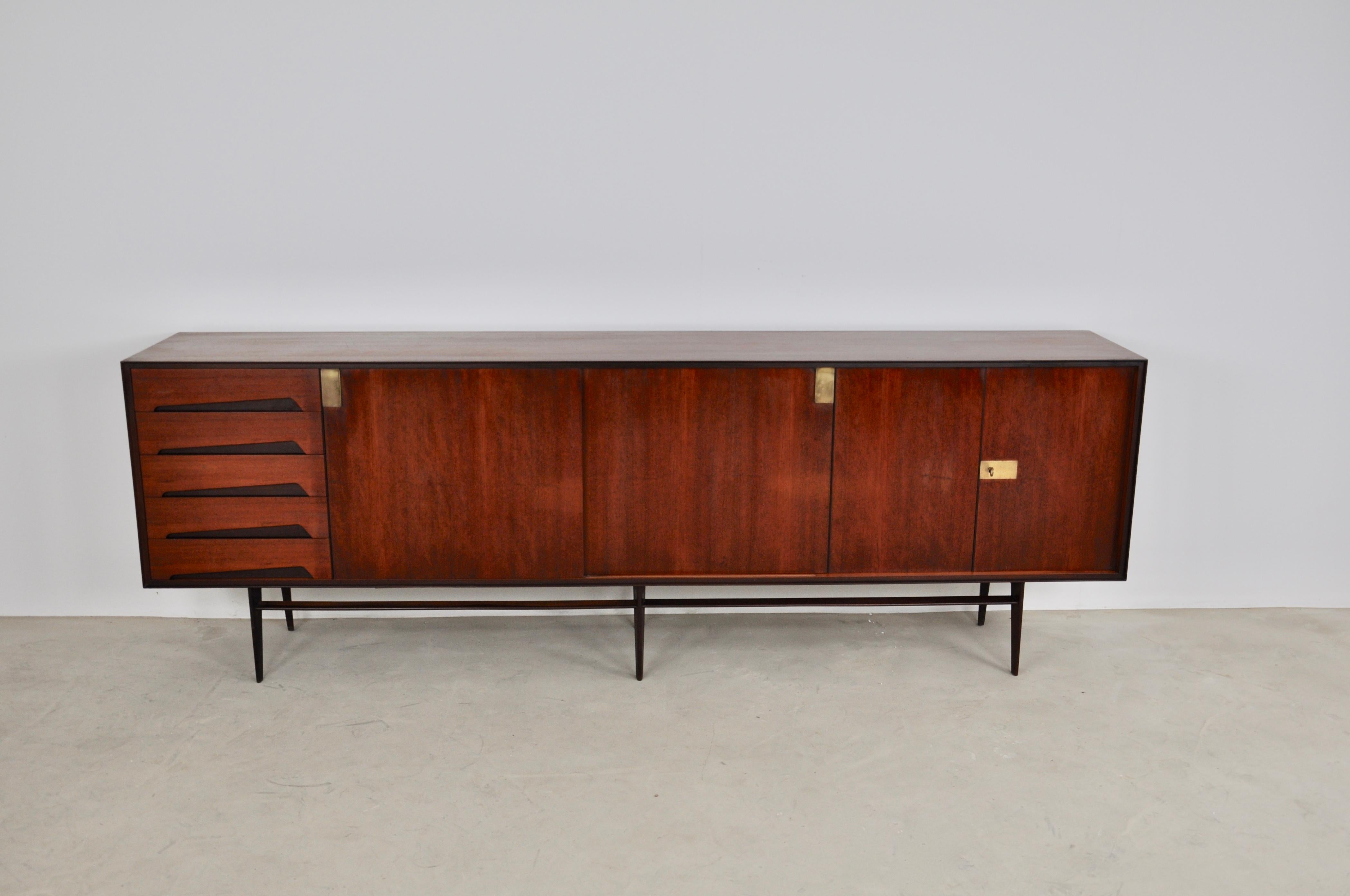 Sideboard composed of 3 doors and 5 drawers. Brass handle. Wear due to time and the age of the sideboard.