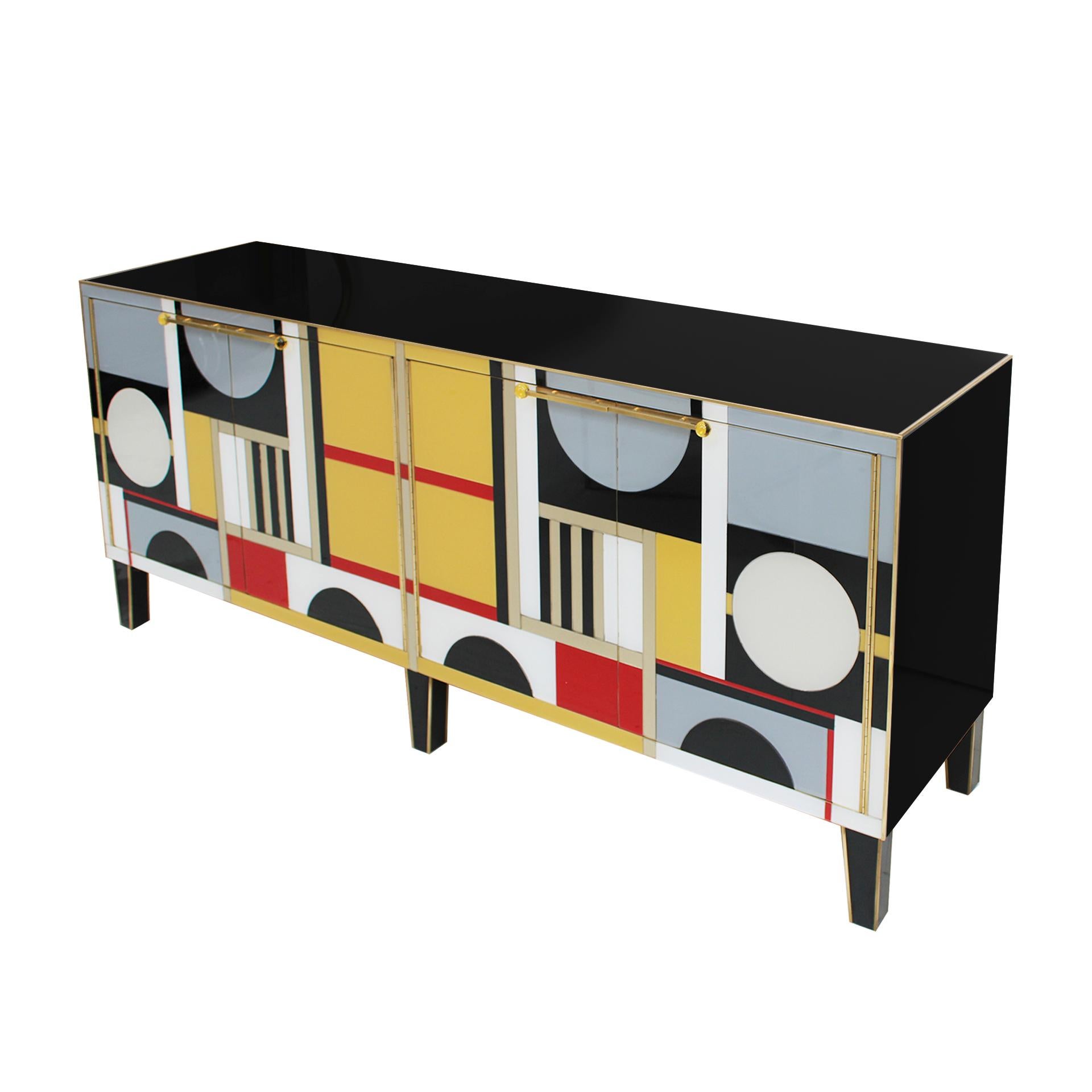 A wonderful and very elegant contemporary sideboard with four doors made with an original solid wood structure from the 50s. Structure made of solid wood covered in colored glass , playing a geometric movement on the surface. Conical feet made of