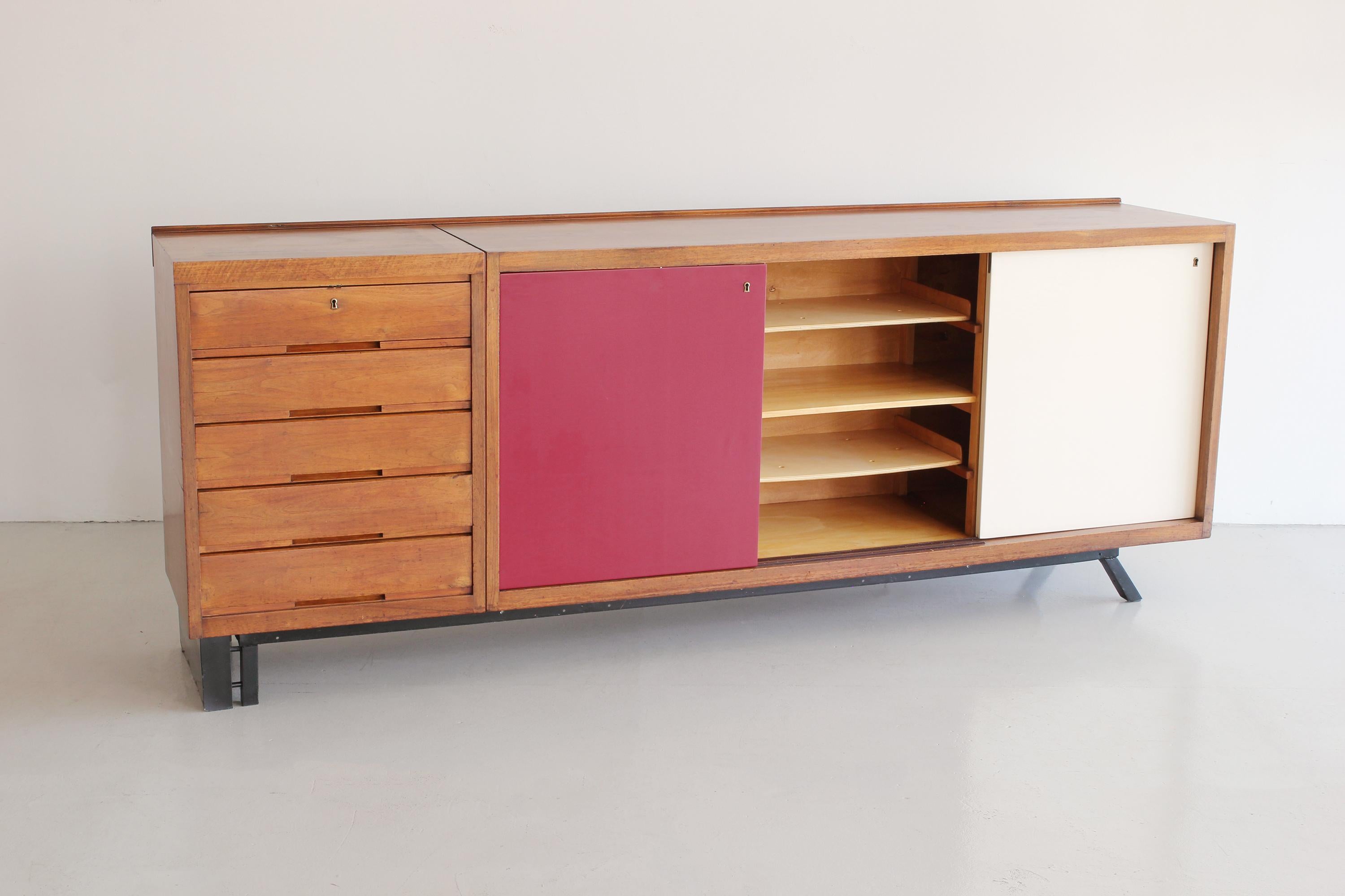 Incredible Italian sideboard in the style of Charlotte Perriand with wood drawers, sliding doors and iron asymmetrical base.