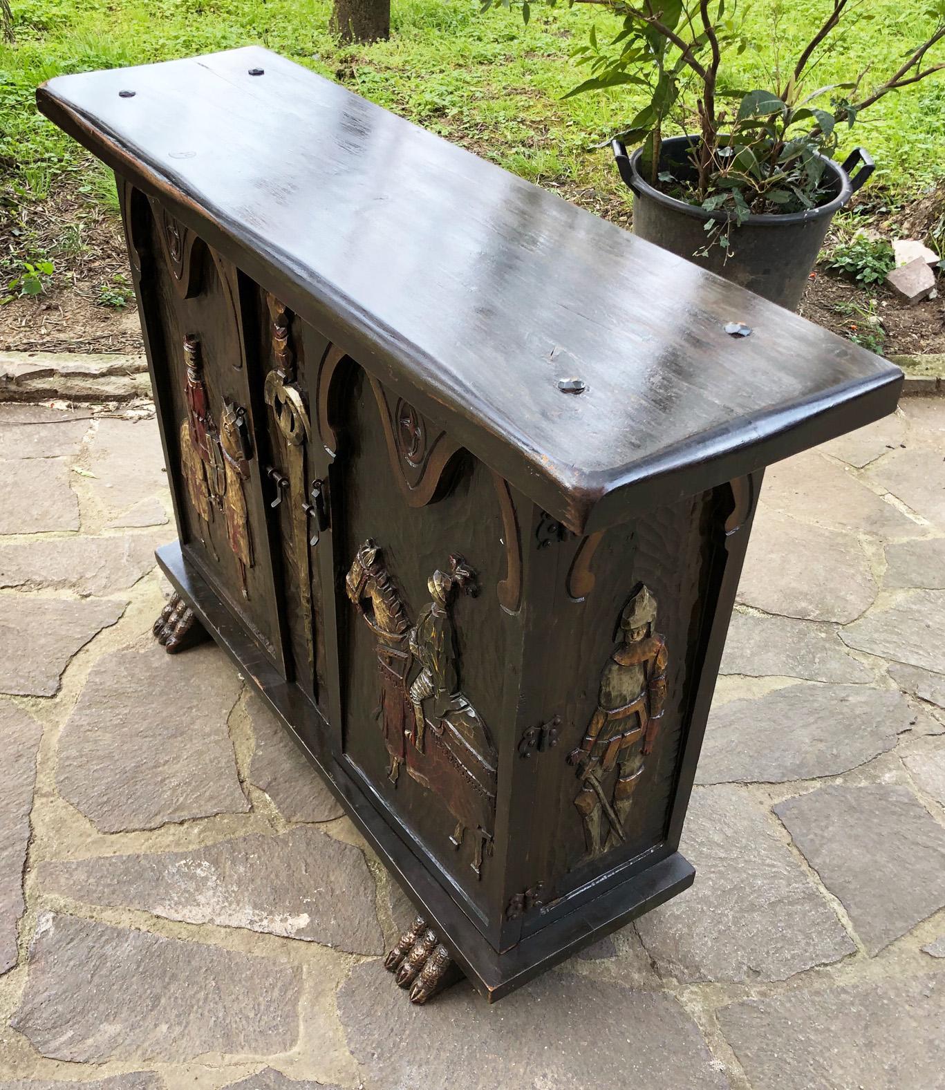 Italian sideboard from 1960, in fir, hand-carved, painted, with two doors.
Dark brown color.
The sideboard has been completely restored, everything is in working order. 
The finish is shellac and wax. 
Comes from an old country house in the