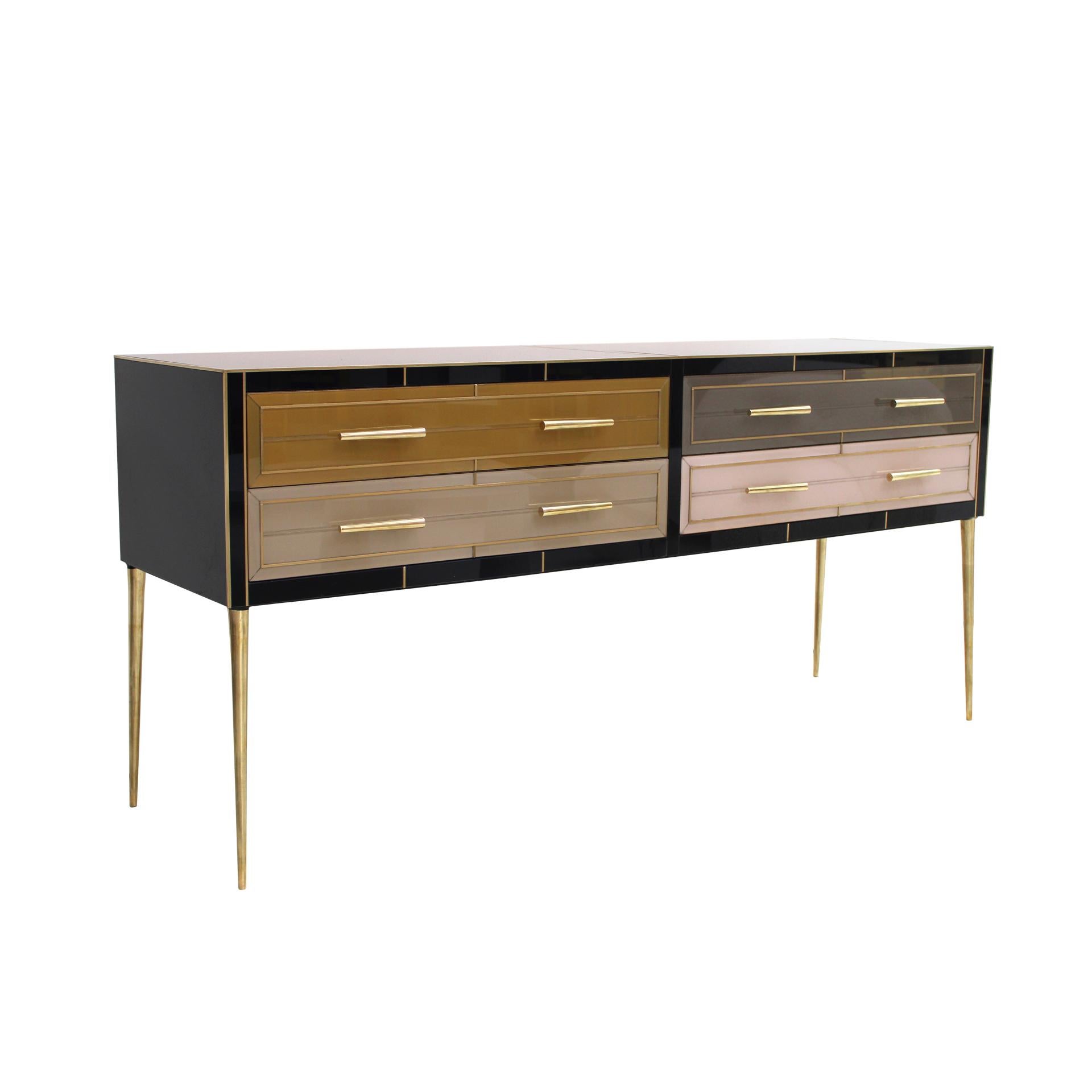 Sideboard composed of 4 drawers with an original structure from the 1950s made of solid wood and covered with colored glass. Handles, legs and profiles made of brass. Italy, 1950s.

Production time between 5 and 6 weeks.

Take into account that the