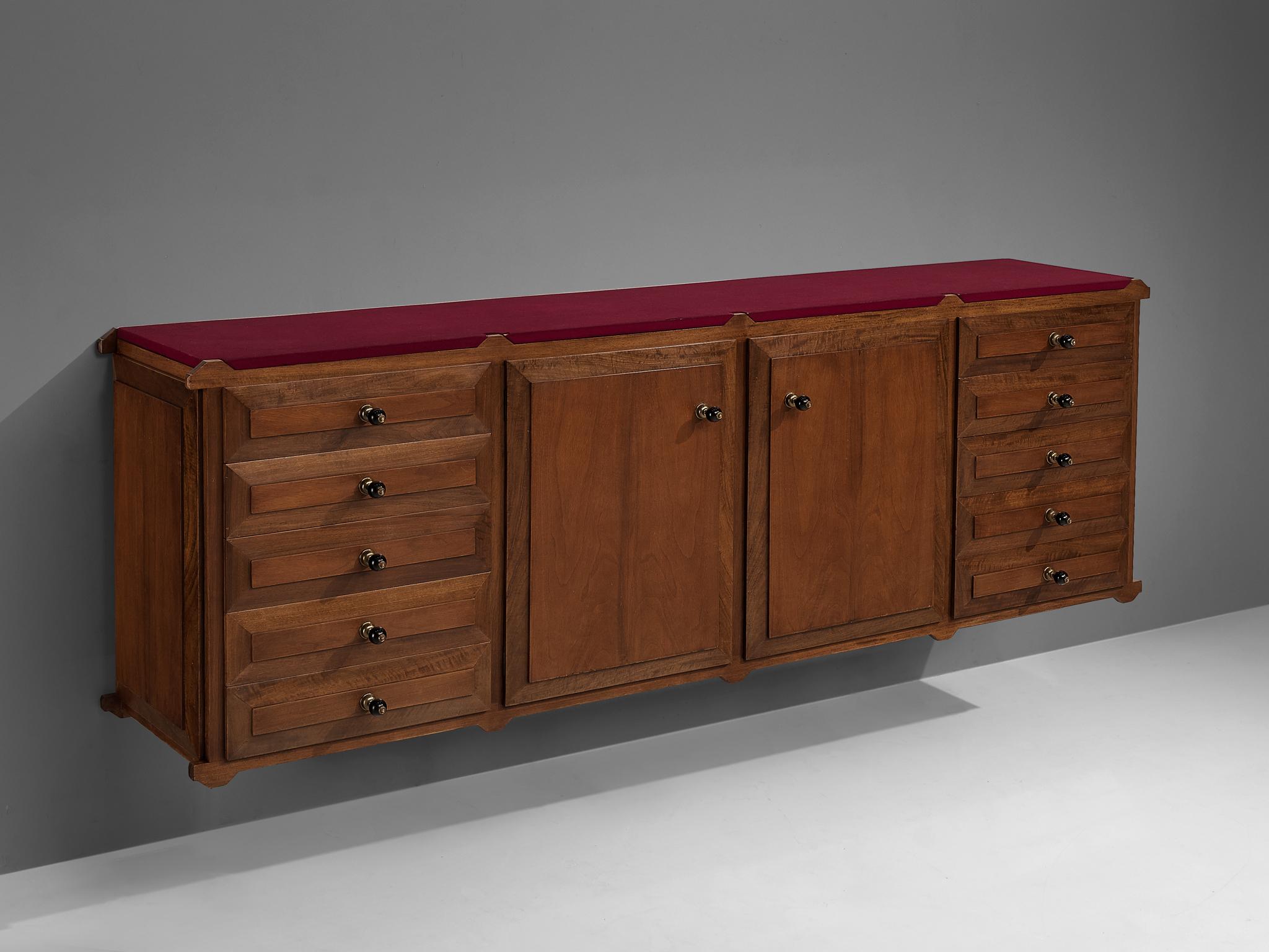 Sideboard, walnut, brass, felt, 1950s

Luxurious credenza finished with elegant brass handles. The sideboard has six drawers on each side and two doors in the middle that provide plenty of storage space. On the inside, the drawers and doors are