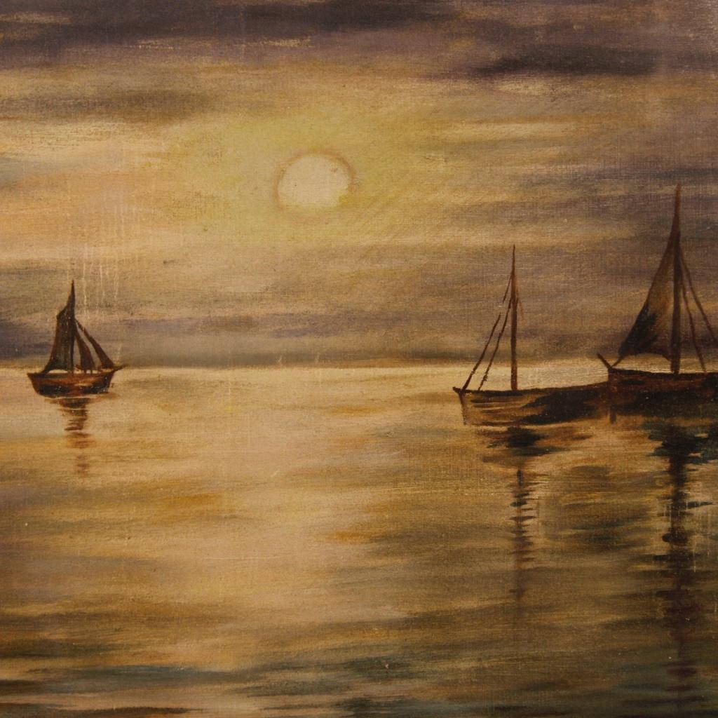 Italian painting of the 20th century. Mixed technique work on canvas (applied on cardboard) depicting a nocturnal seascape with boats of good pictorial quality. Picture with wooden frame
golden, painted wooden passe-partout and protective glass.