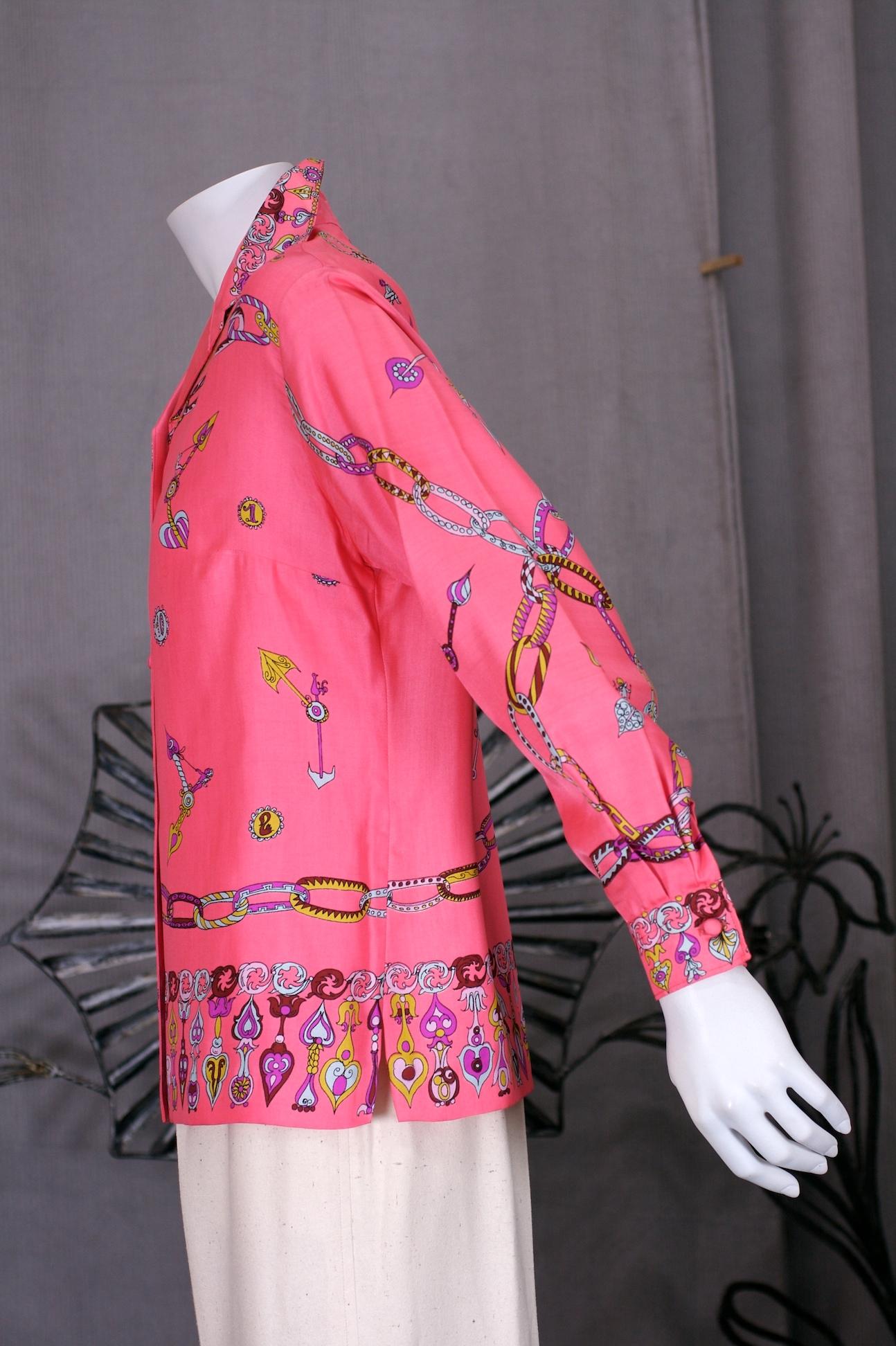 Italian Silk Print Blouse in pink silk twill with jewelry watch print placed along hem and shoulders. Watch parts and angels are used throughout the printed textile. 
1960's Italy. Small size.