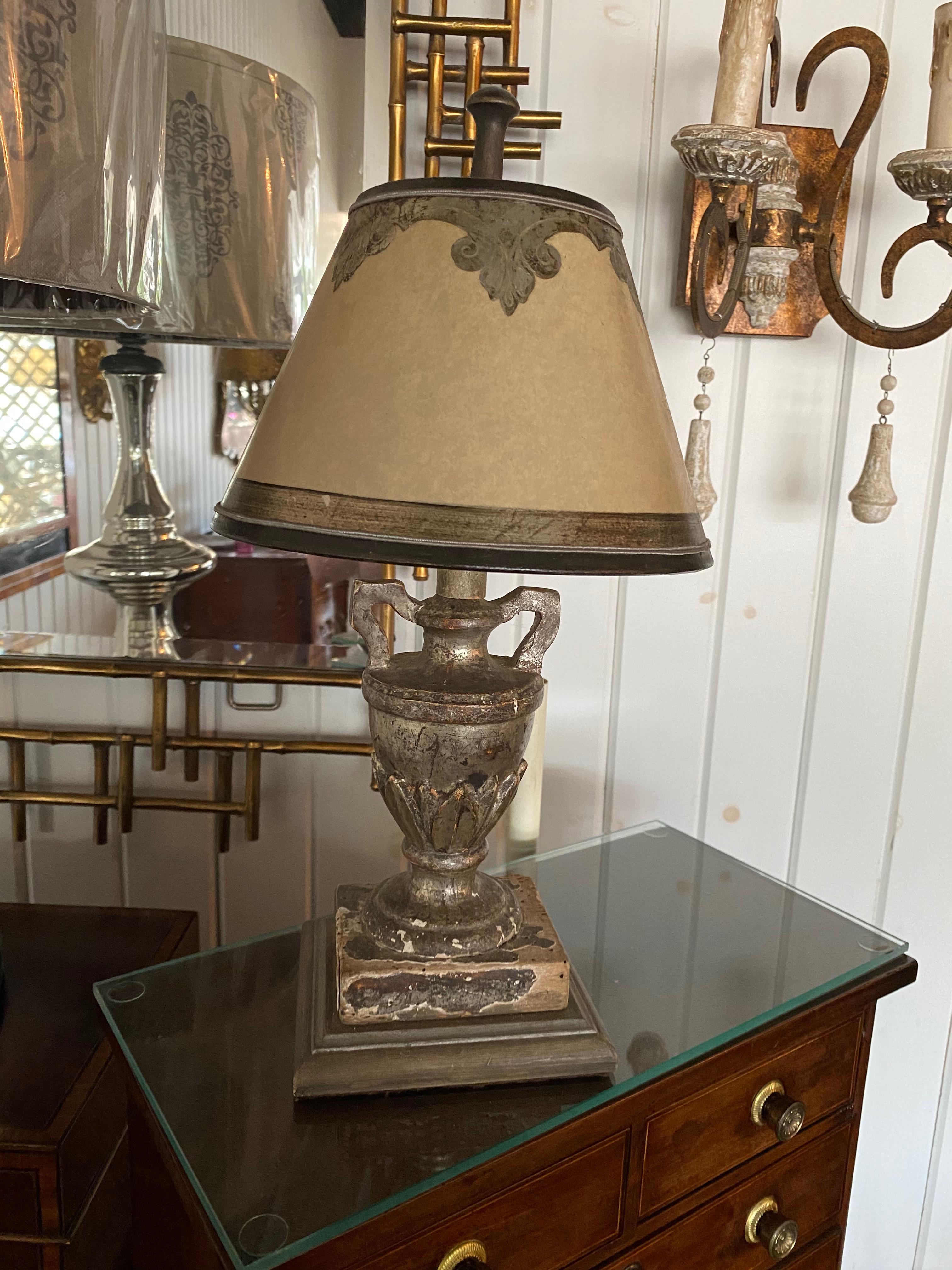 Very nice 18th century Italian urns converted into lamps with custon parchment shades, silver leaf. These would be charming sconces on wall brackets.  