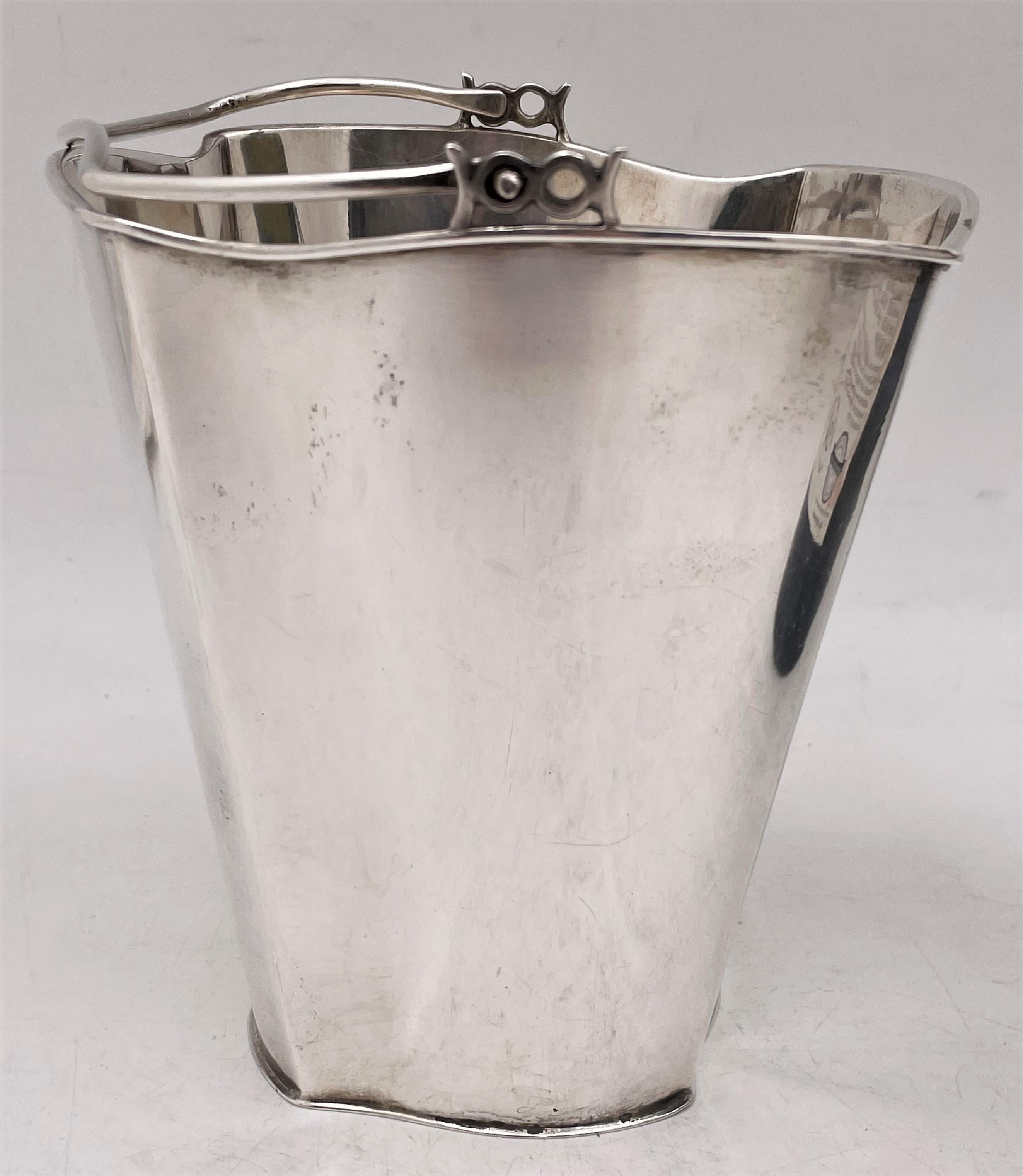 Italian, continental silver ice bucket or wine cooler in Mid-Century Modern style, made in Milan in the Mid-20th Century, by Eugenio e Angelo Orefice, with a curvilinear, geometric design. It measures 5 1/4'' in height by 3 1/2'' at the base (widest