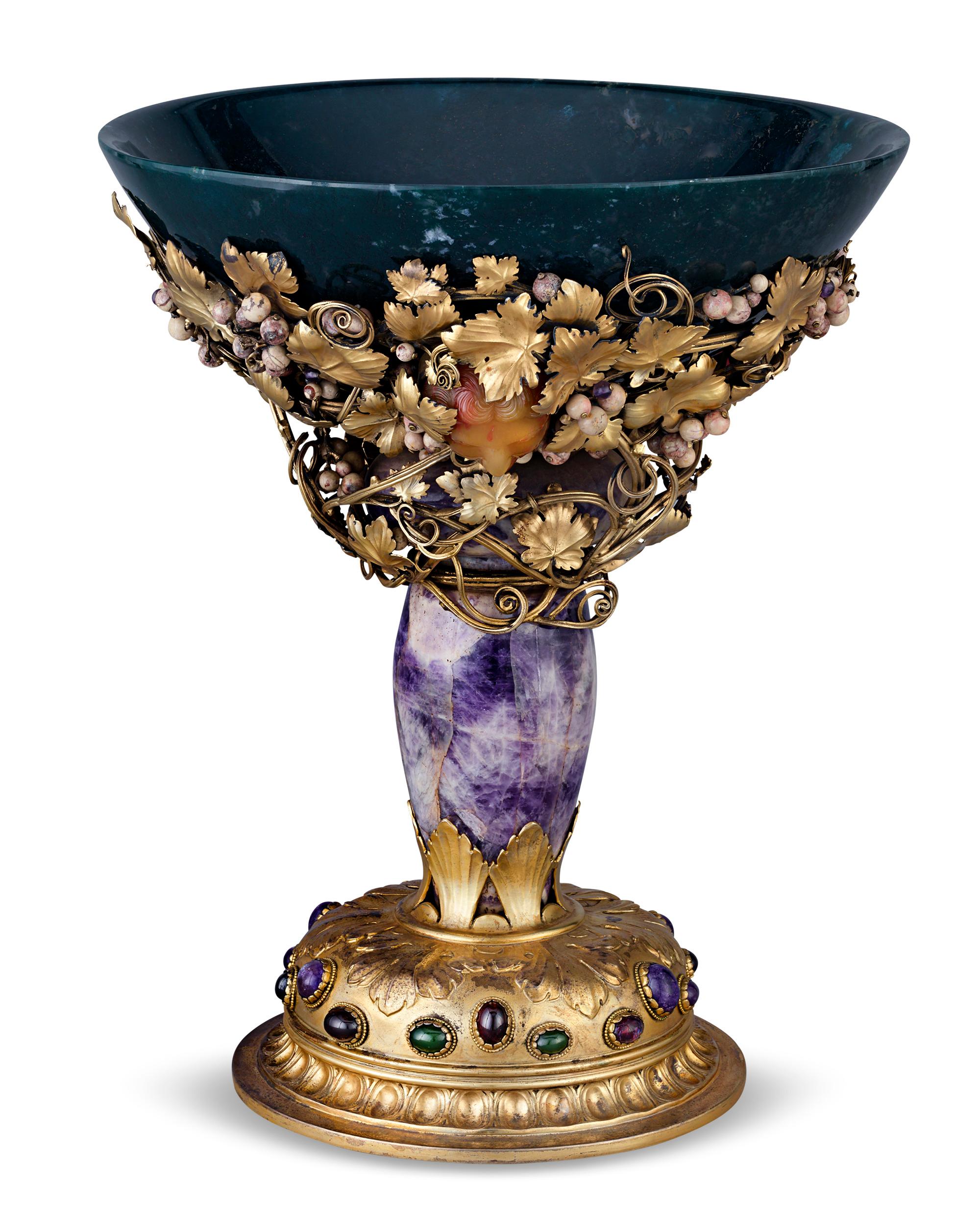 This unique Italian hardstone centerpiece is a luxurious example of the Renaissance Revival style. The design is formed primarily from semiprecious stones — its bowl is carved from a lovely example of moss agate, while a large specimen of amethyst