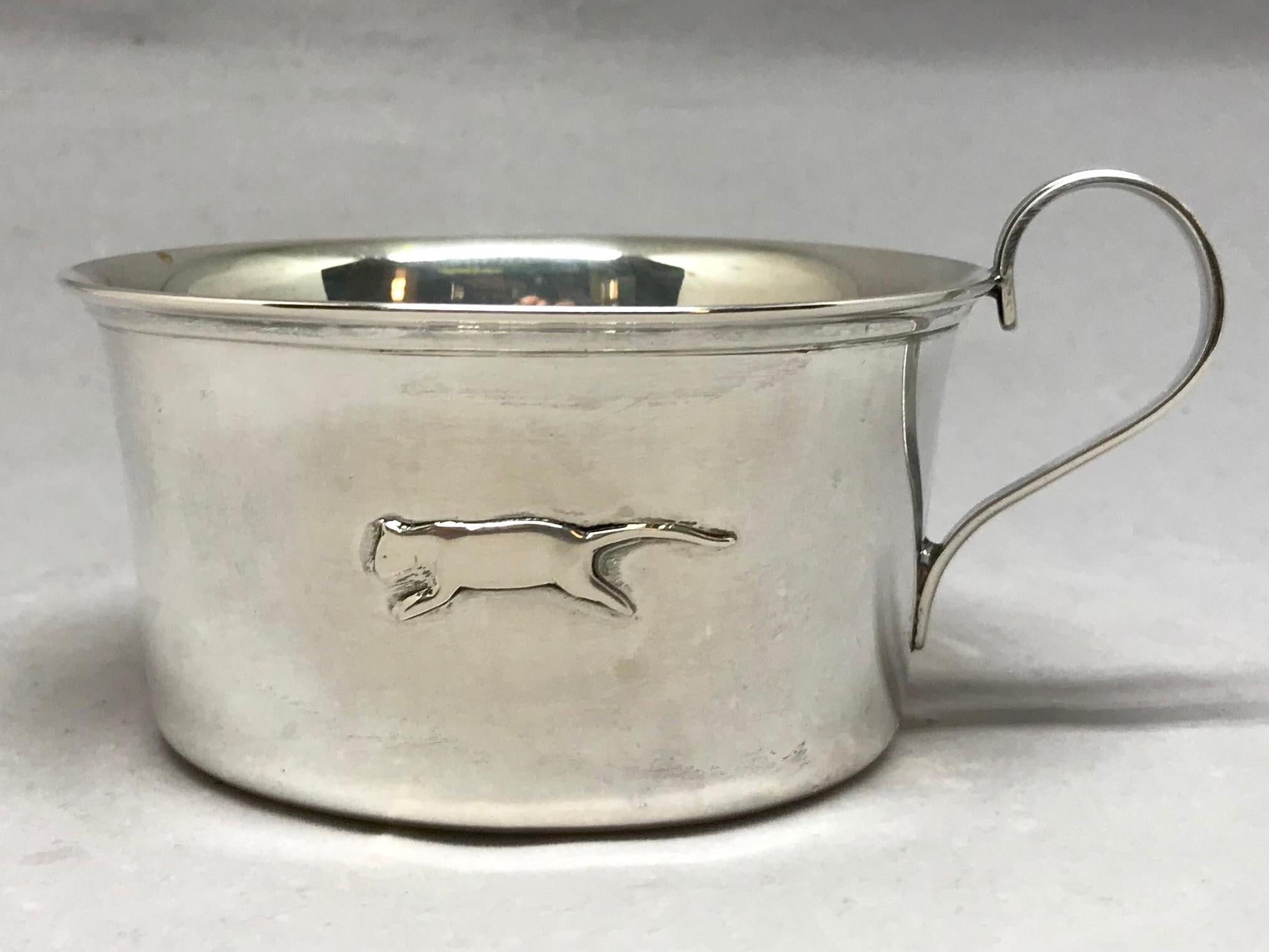 Italian silver panther baby cup. Vintage sterling cup with low wide brim of elegant proportion with raised Silhouette of a panther or leopard; stamped 20 AL & 800. Italy, mid-20th century.
Dimensions: 4.75” across to handle; 3.75” diameter x 2.25”