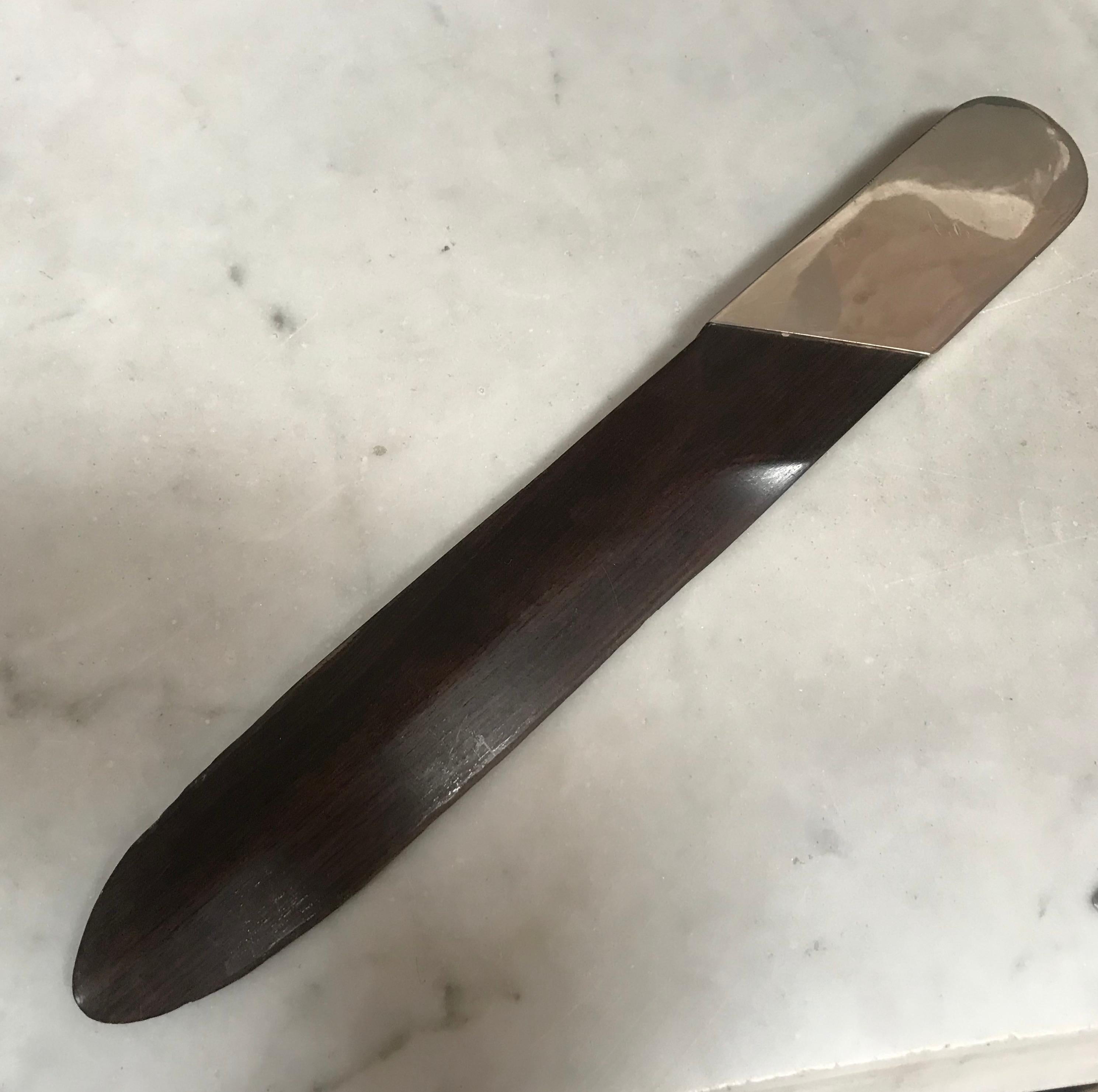 Italian silver plate and black wood turner letter opener, 1970s.
Hand carved!