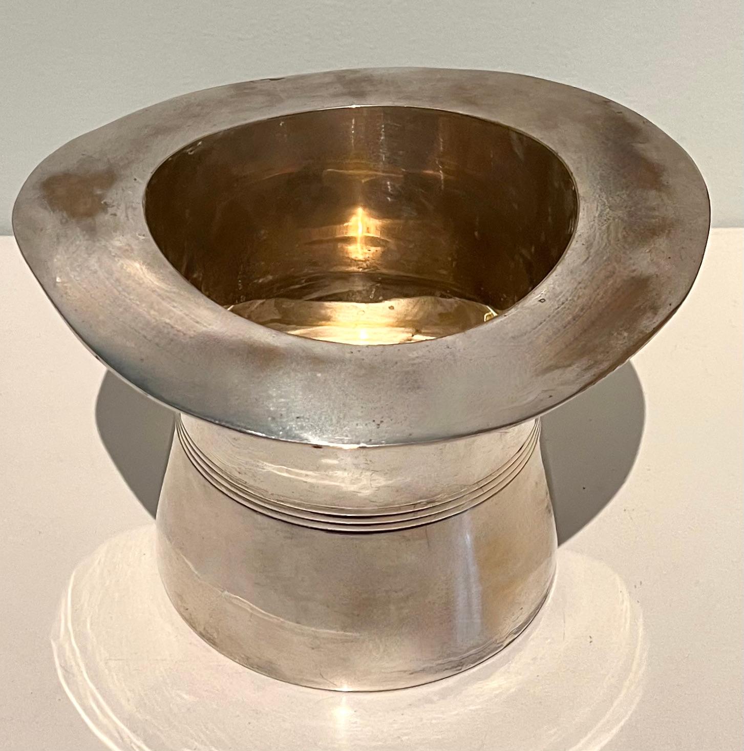 Silver plate top hat ice or champagne bucket from Italy. The mid century piece is a compliment to many bars and is a great nod to any celebration with the shape of a top hat. The piece when loaded with ice and bubbly has a very nice 