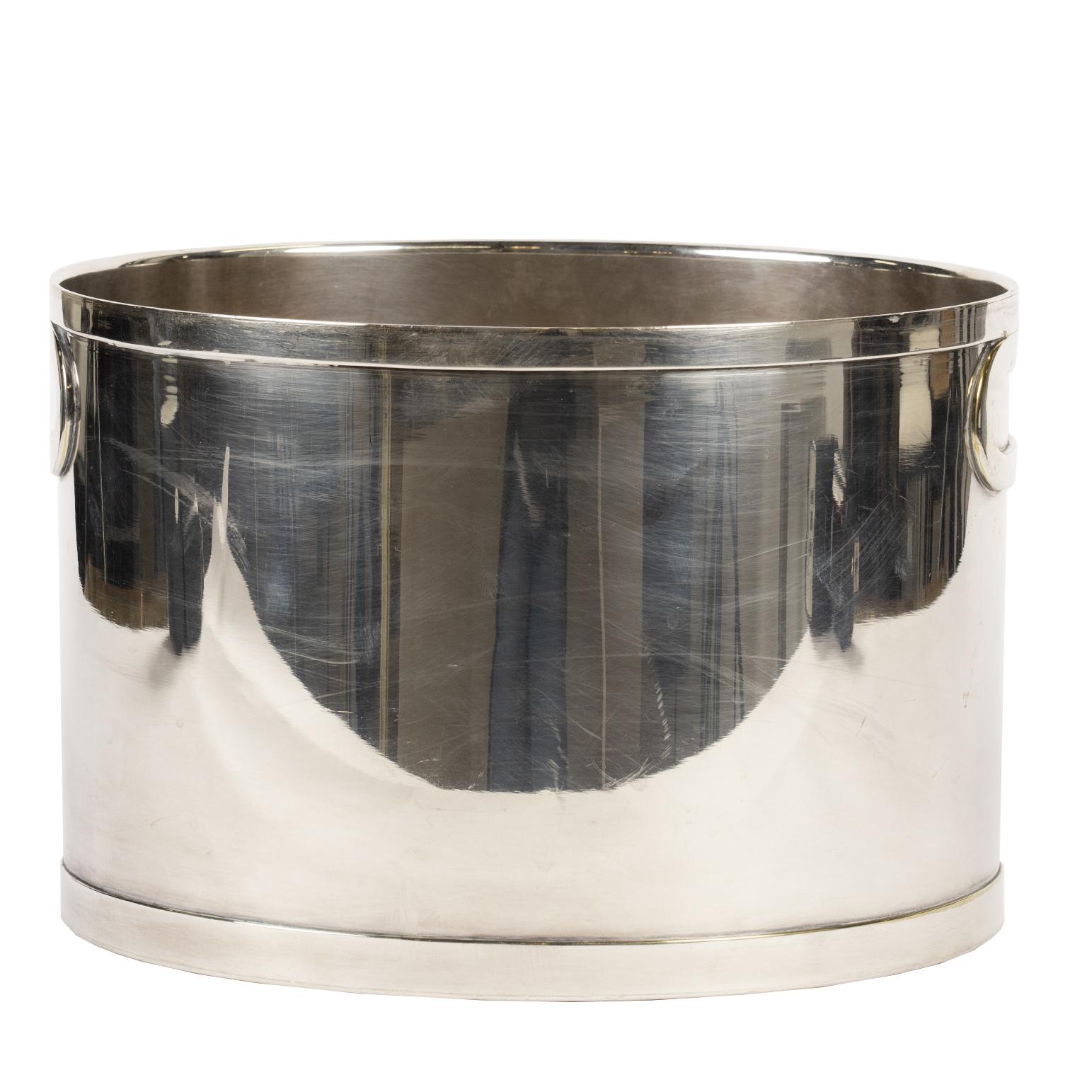 This is a very cool double bottle oval champagne bucket stamped Egidio Broggi Milano on the underside. What is special about this wine cooler is the minimalist, almost understated,design with its low profile handle on either side and the narrow