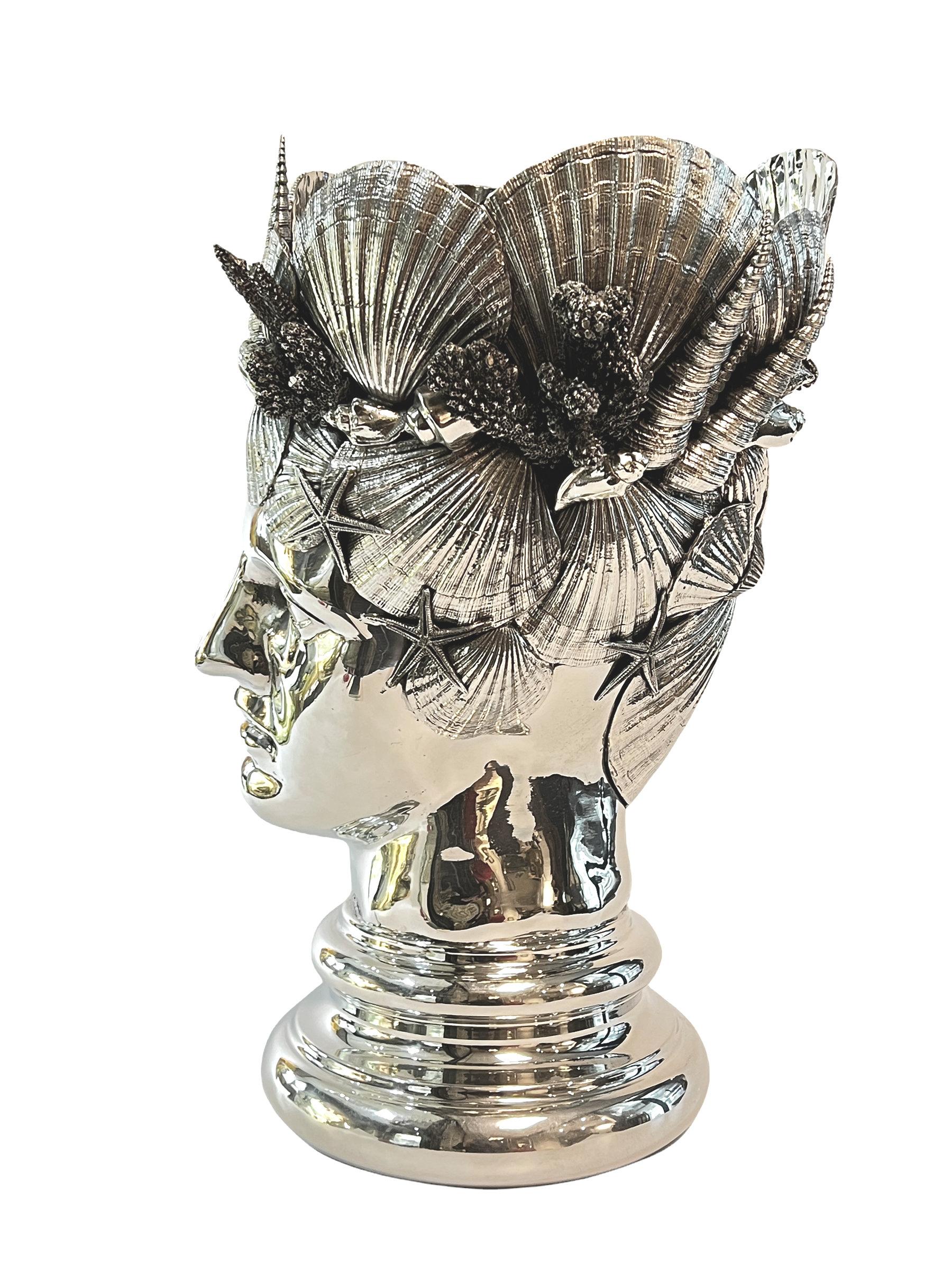 Our large silverplated pewter vase or champagne bucket depicts a male sculpted in the neoclassical style with elaborate crown of seashells and coral, inspired by the Poseidon and Neptune, gods of the sea from Greek and Roman mythology. In excellent