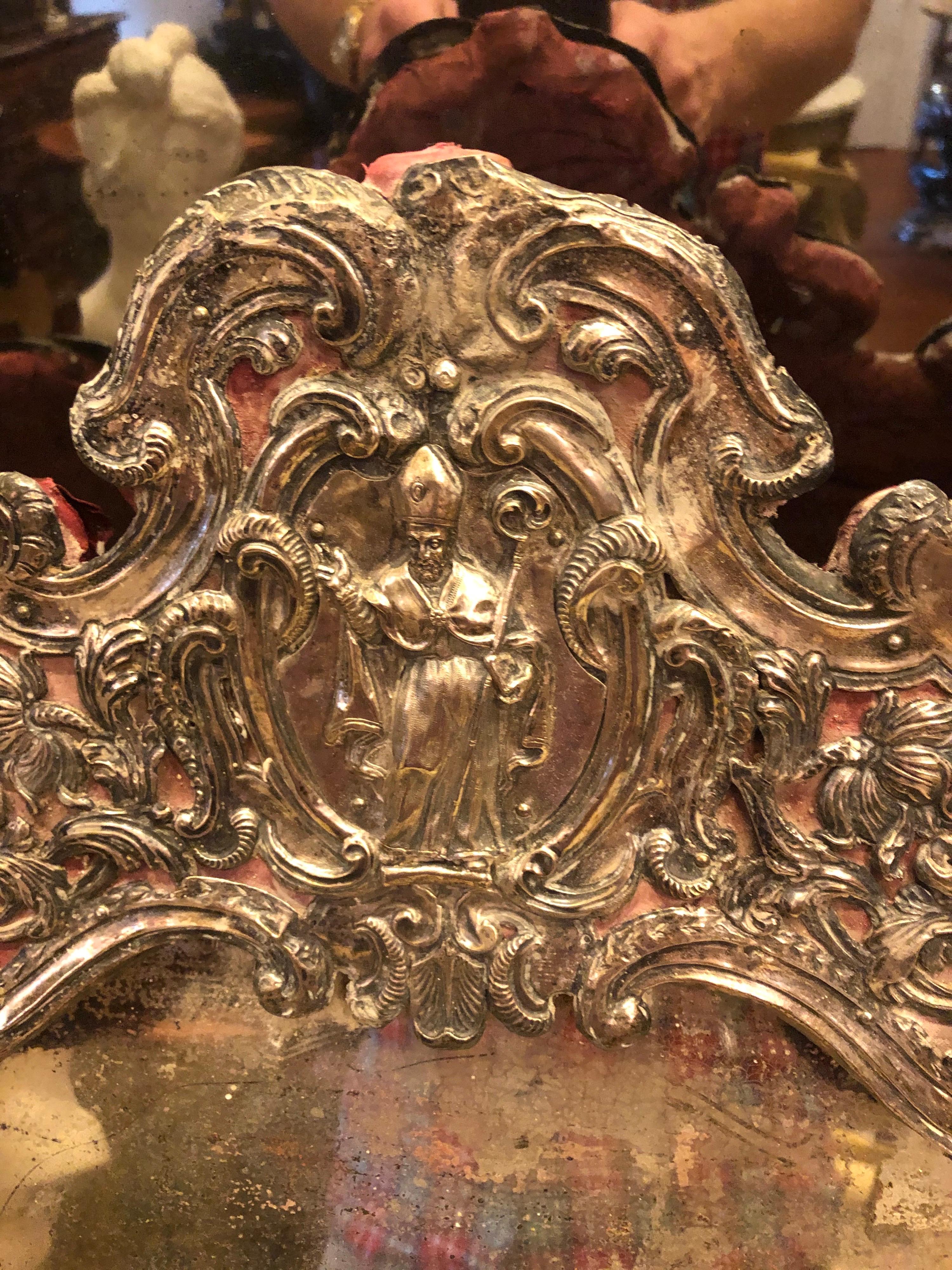 Italian silver table mirror with ecclesiastical motif.