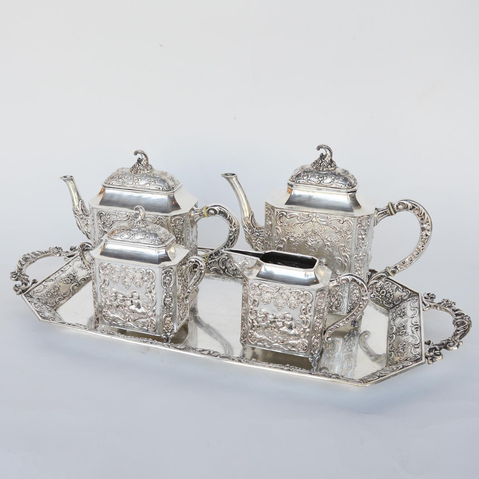 Italian Silver Tea Set Late 19th Century

Dimensions

25 in L x 11.8/5 in W (Tray)

8.5 in H x 11 in W x 3 3/4 in D (Teapot)

11.1 in W x 9.1/2 in H x 3.1/2 in D (coffeepot)

6 .1 in H x 7 in W x 3 in D (Teapot)

4.7 in H x 7 in W x 2.1/2 D (Creamer)
