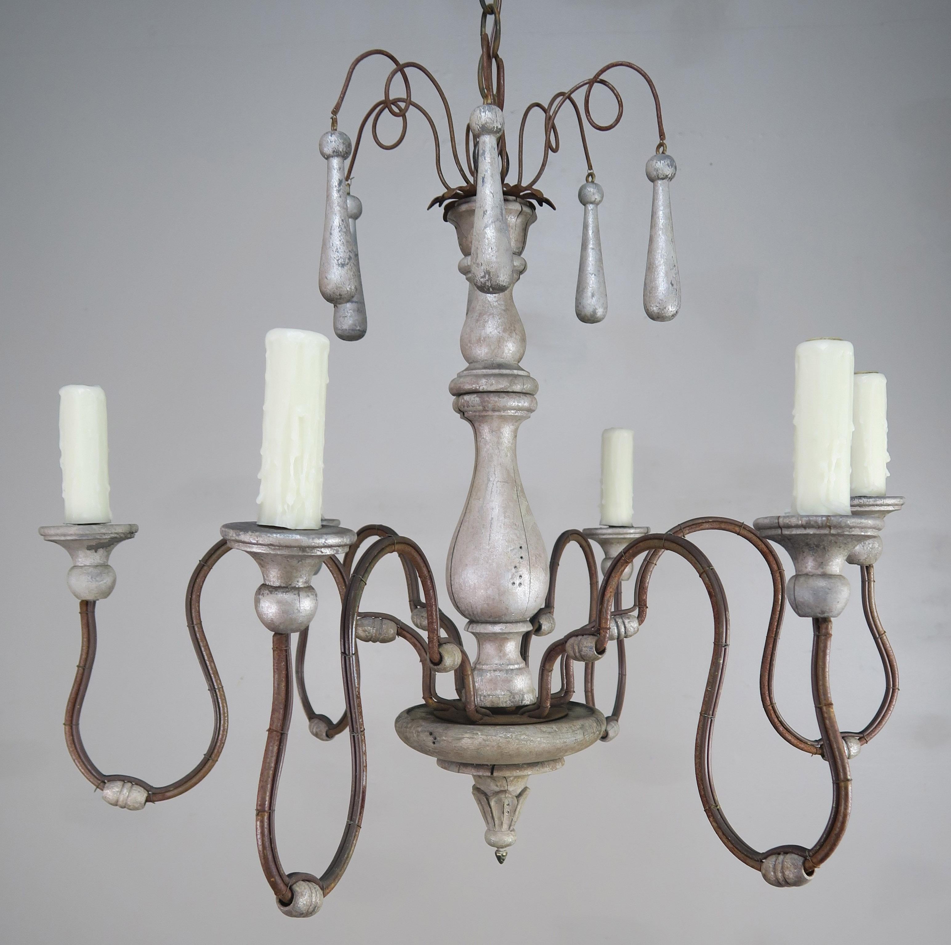 Italian silvered wood and iron six light chandelier with silver wooden drops throughout. The fixture is newly rewired with drip wax candle covers and includes chain and canopy. Ready to install and use.