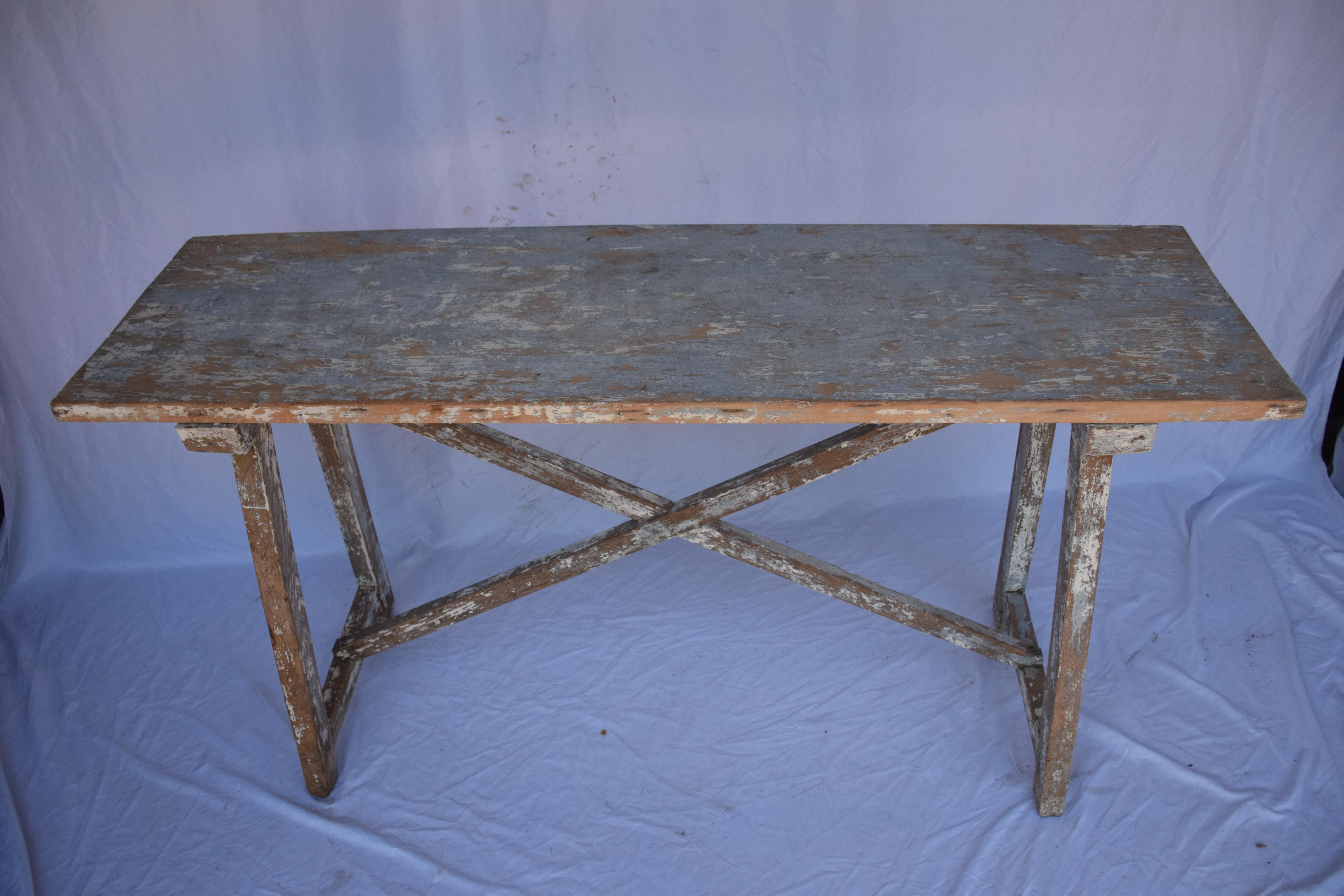 Italian Single Slab Trestle Console Table features paint remnants of blue/gray, cream, and natural wood showing through. Great accent piece for an entry, behind a sofa, or stand alone with an accessories display.