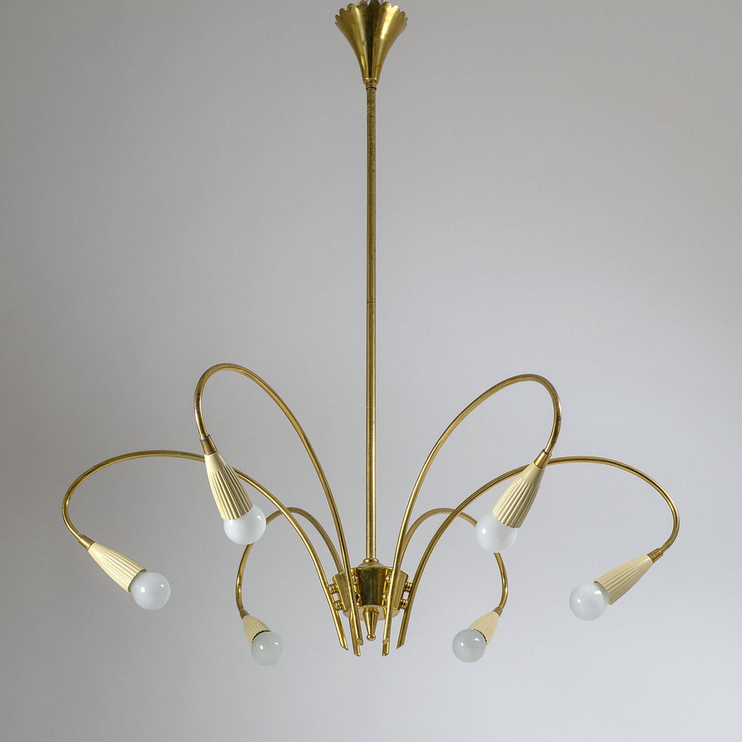 Very fine Italian brass chandelier from the early 1950s or possibly late 1940s. Nice example of how traditional designs were reworked with a modernist approach during these early post-war years. The chandelier is entirely in brass with the exception