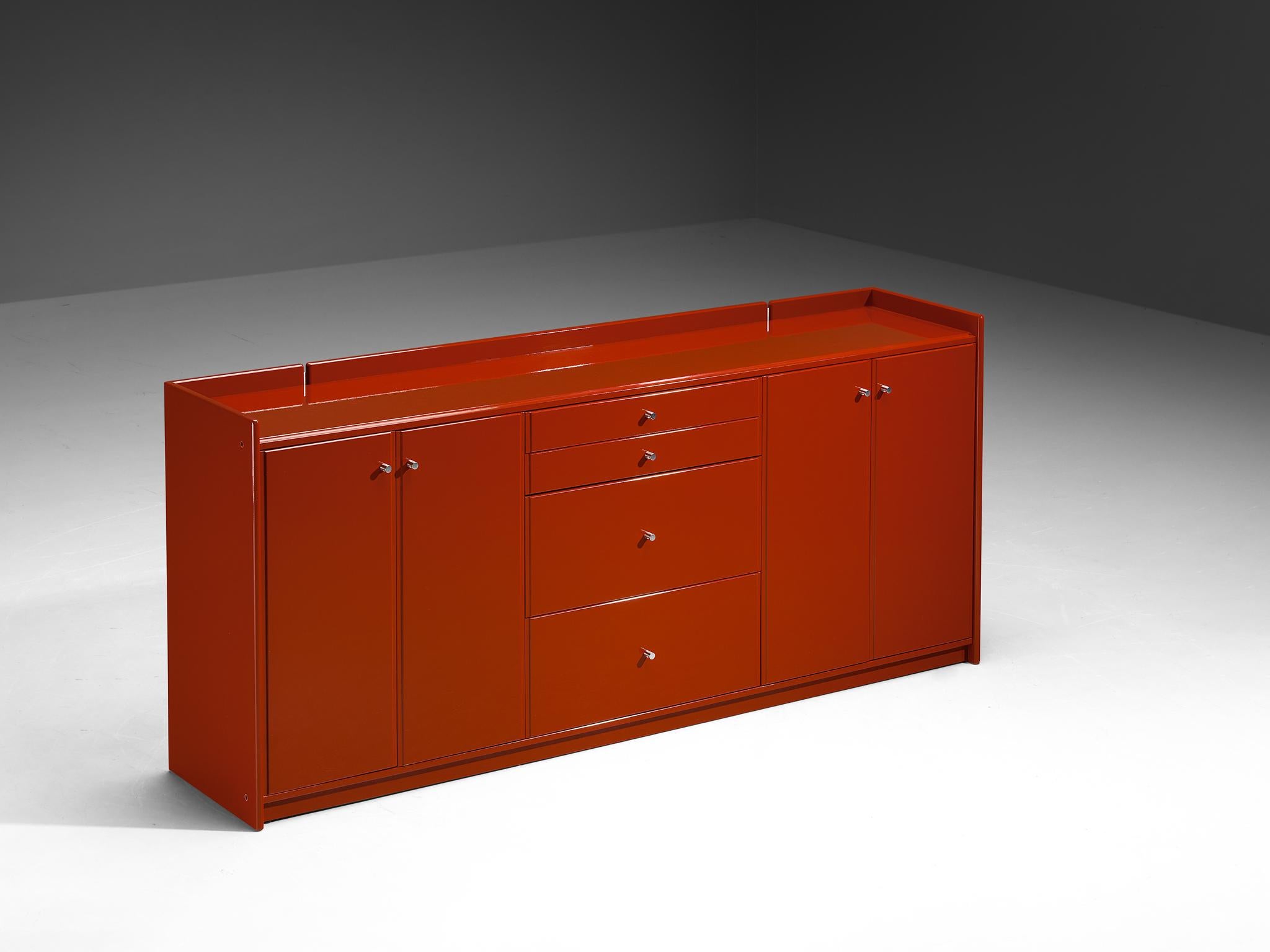 Sideboard, lacquered wood, aluminum, Italy, 1970s/80s

This Italian-made credenza, dating from around the 1970s or 1980s, exemplifies robust craftsmanship, characterized by a harmonious interplay of sharp, precise lines and gentle contours. The high