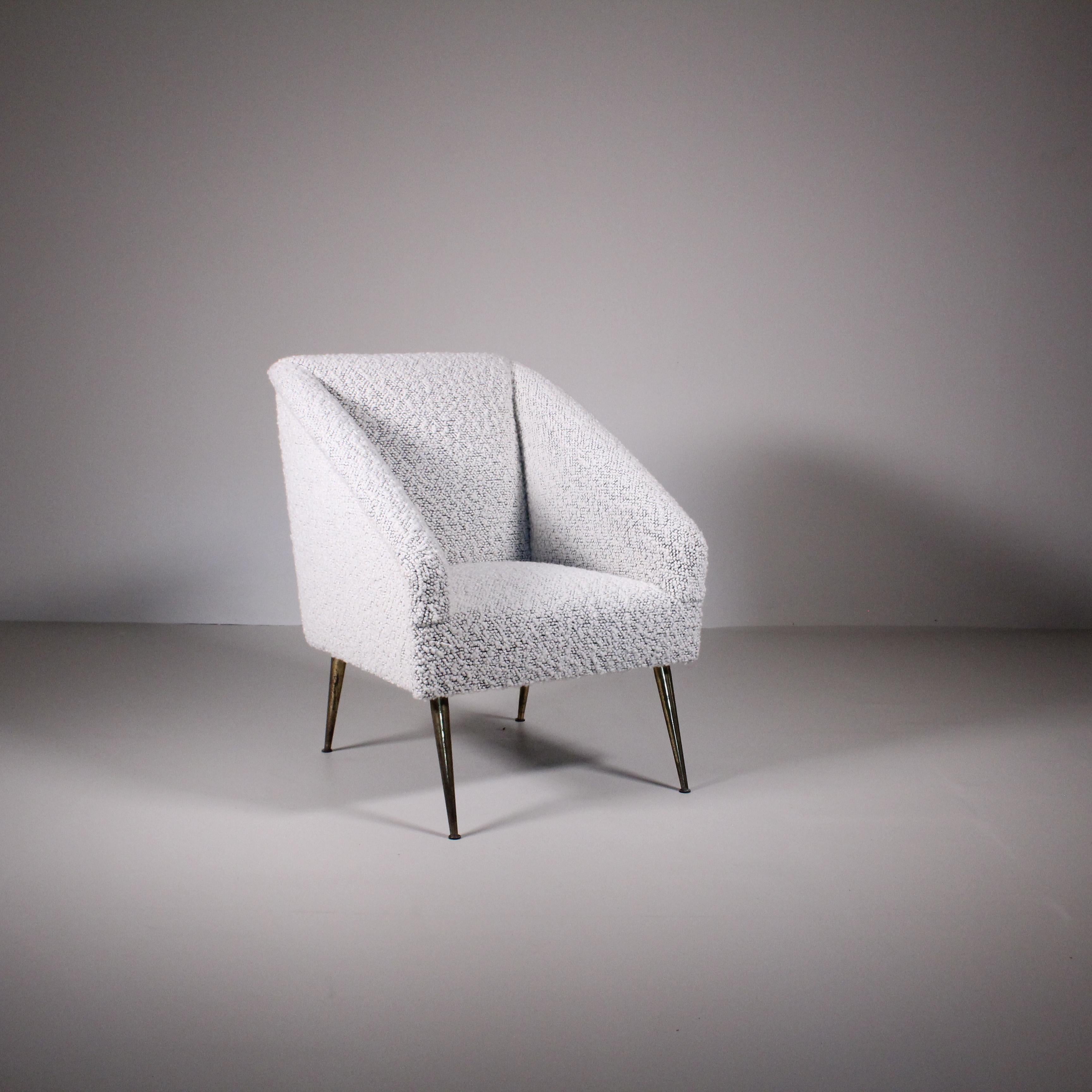 Italian manufacture armchair reupholstered with a white bouclé fabric.  Perfect for any kind of space,