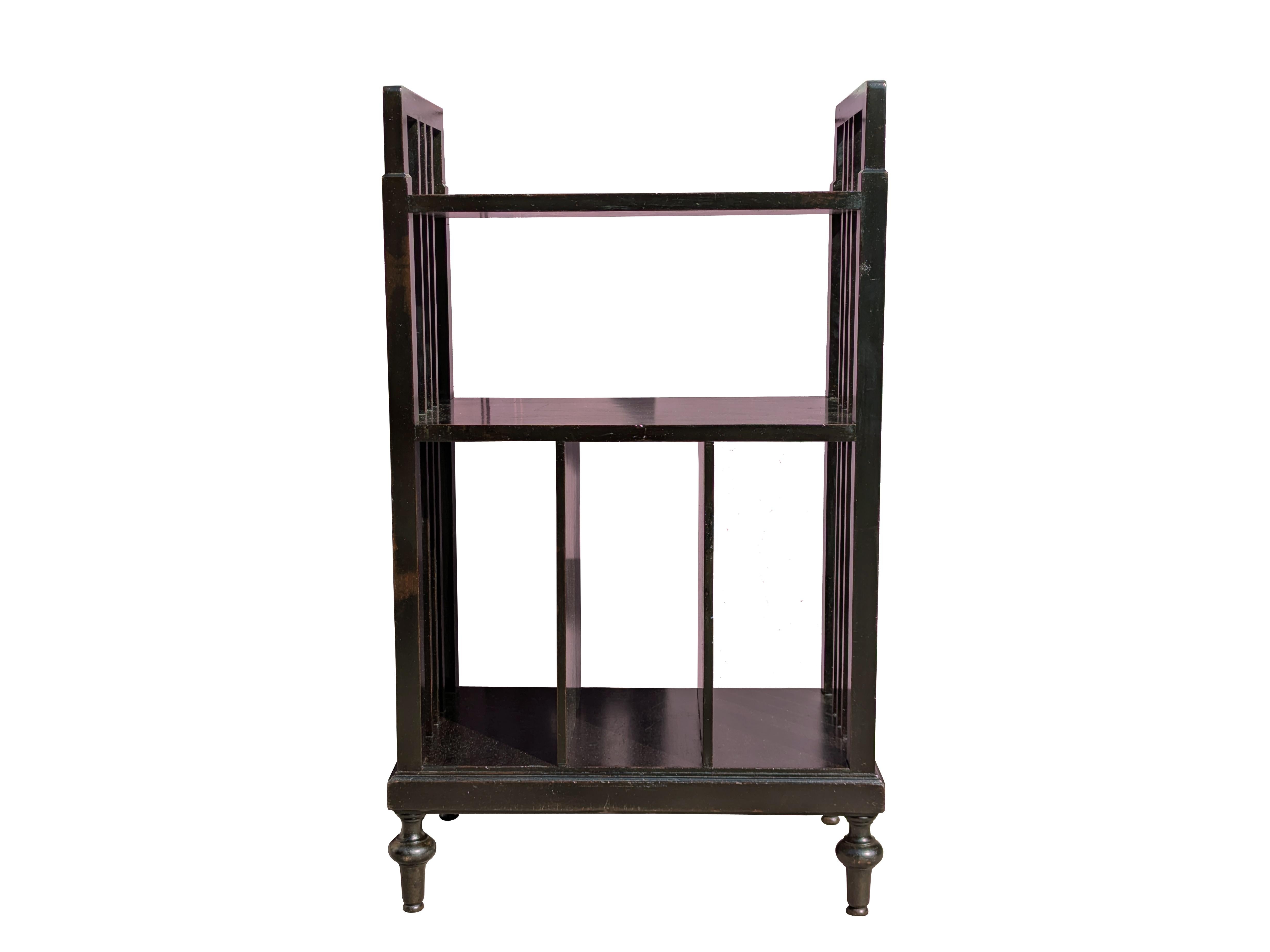 Small Art deco bookcase in black stained wood from the 30s.
the bookcase has 3 fixed shelves and 4 compartments. Rather dry and elegant design, with a pleasant molding of the 4 shaped feet and the slightly wavy profile of the sides.