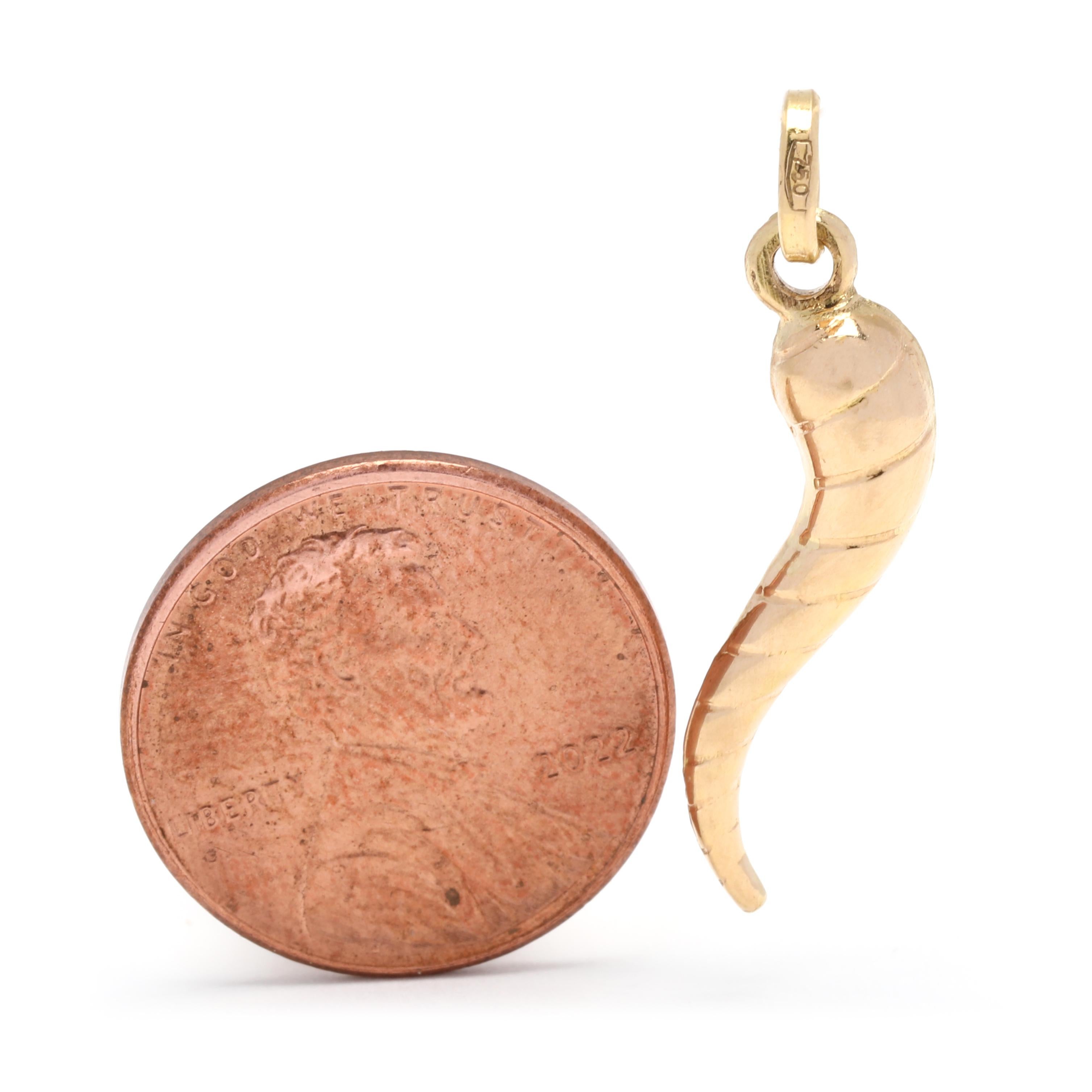 This beautiful Italian cornicello horn charm is made of 18K yellow gold and measures 1 1/8 inch in length. This charm is traditionally believed to bring luck and good fortune to its wearer. The elegant cable design adds a touch of sophistication to