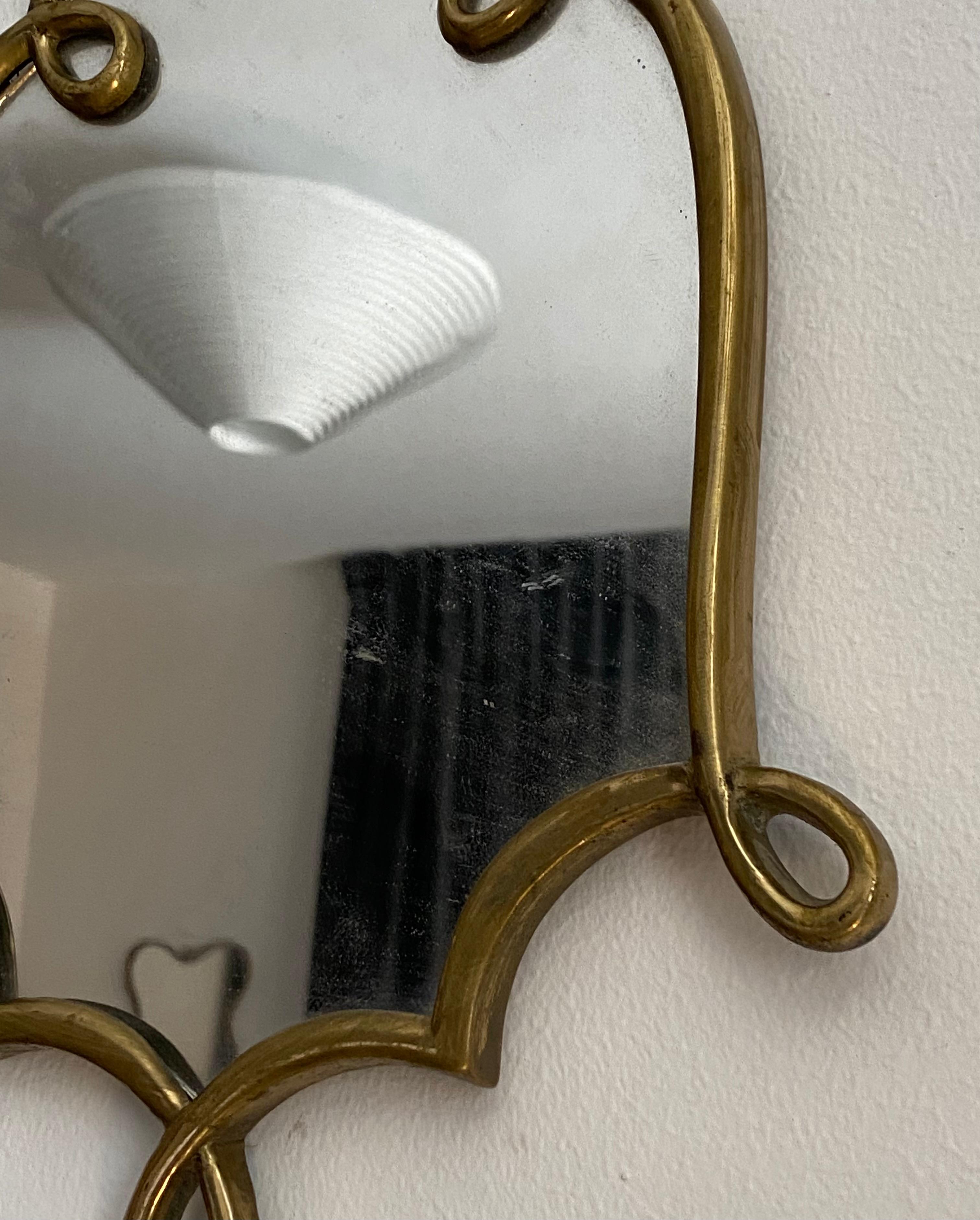 A small organic wall mirror, produced in Italy, 1940s. Organically cut mirror glass is framed.

Other designers of the period include Gio Ponti, Fontana Arte, Max Ingrand, Franco Albini, and Josef Frank.