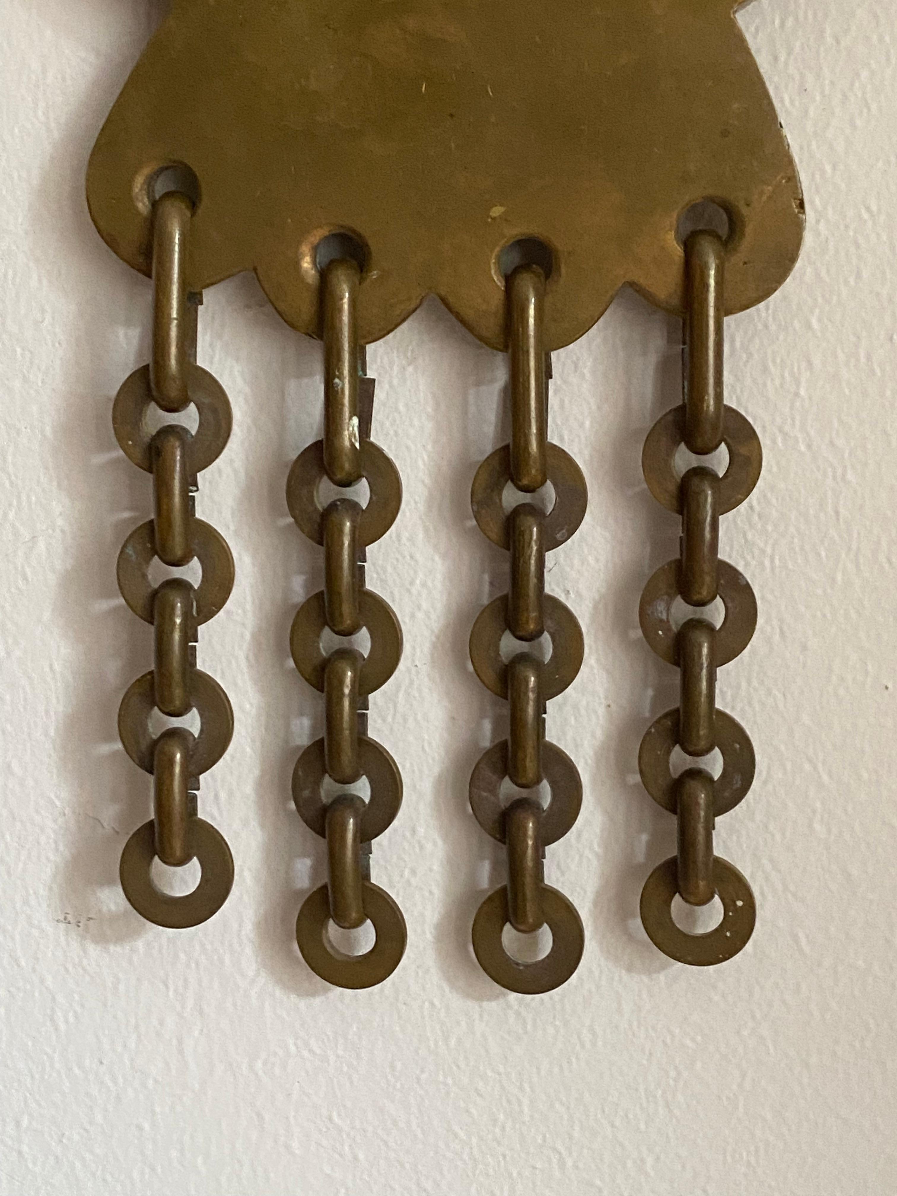A small organic wall mirror, produced in Italy, 1940s. In heavy alloy brass with ornamental chains.

Other designers of the period include Gio Ponti, Fontana Arte, Max Ingrand, Franco Albini, and Josef Frank.