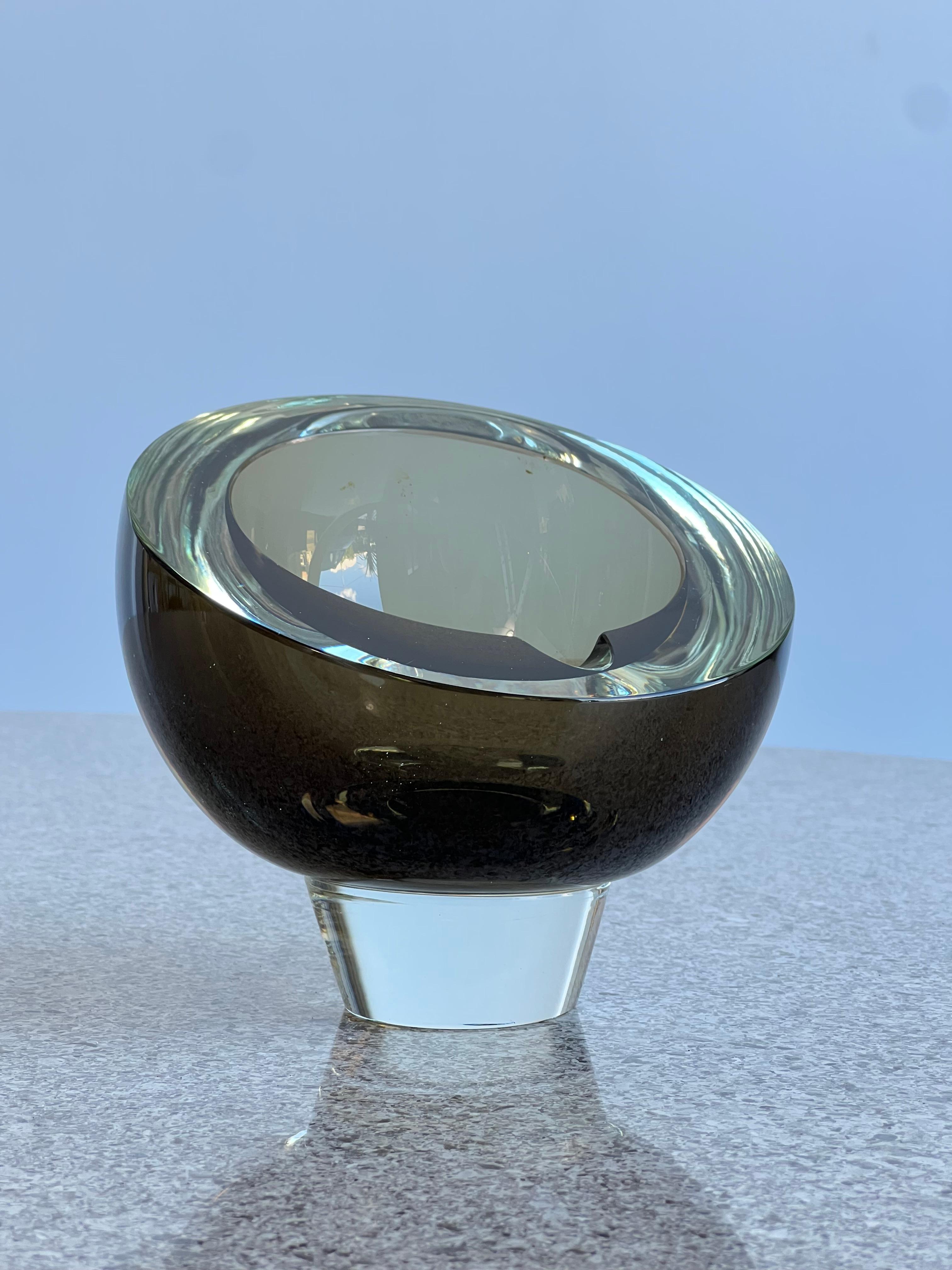 Mid-Century Modern ashtray in Murano glass 1960s.
Smoked glass ashtray very modern design and stylish look.
 