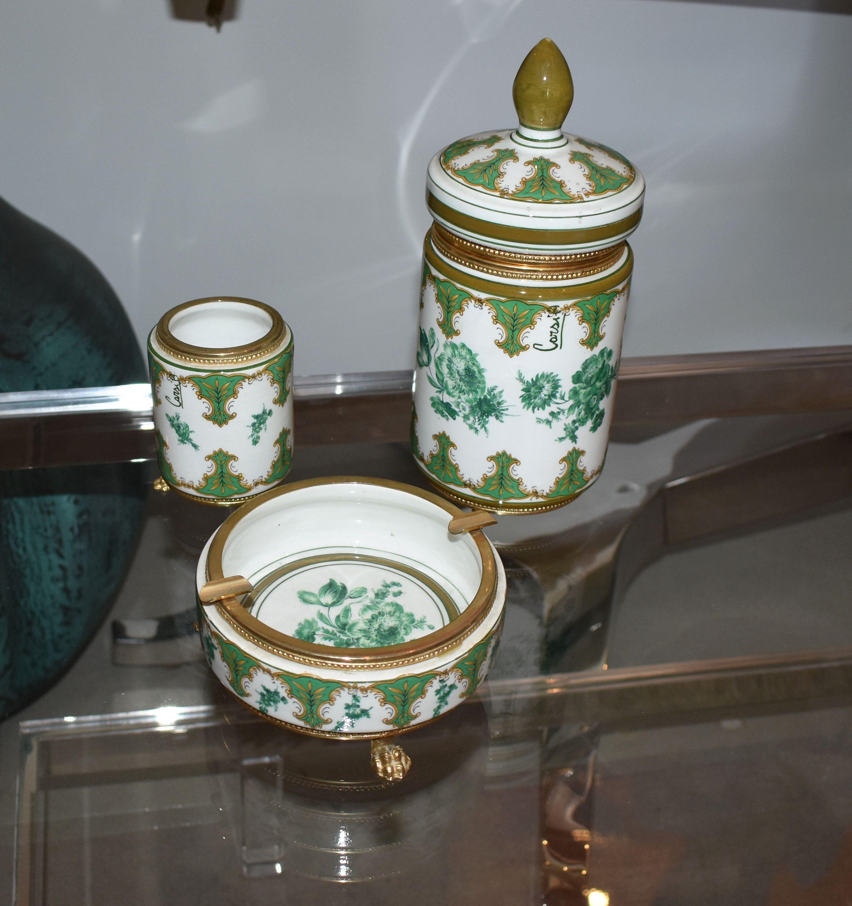 Three pieces smoking set by Corsi A. for J.B. Hirsch Co.

Measurements:
Ashtray diameter 5.25 inches h 2.5 inches
Jar diam 4 inches height 9.5 inches
Match holder diameter 2.75 inches height 3.75 inches

Exquisite Jar, match holder and