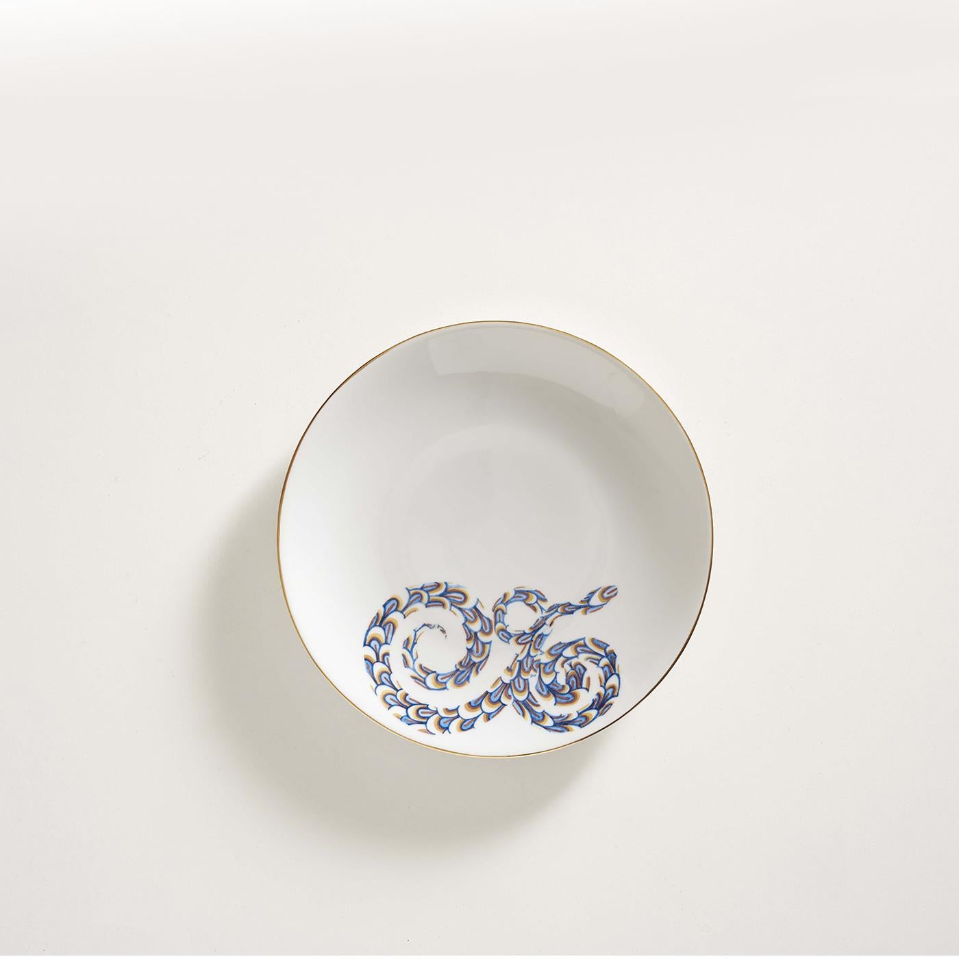 This superb set of dishes is made of one dinner plate, one soup plate, and one dessert plate. Each piece is designed and made in Italy using the finest Limoges porcelain. The decorations are based on hand-painted watercolors and depict a snake
