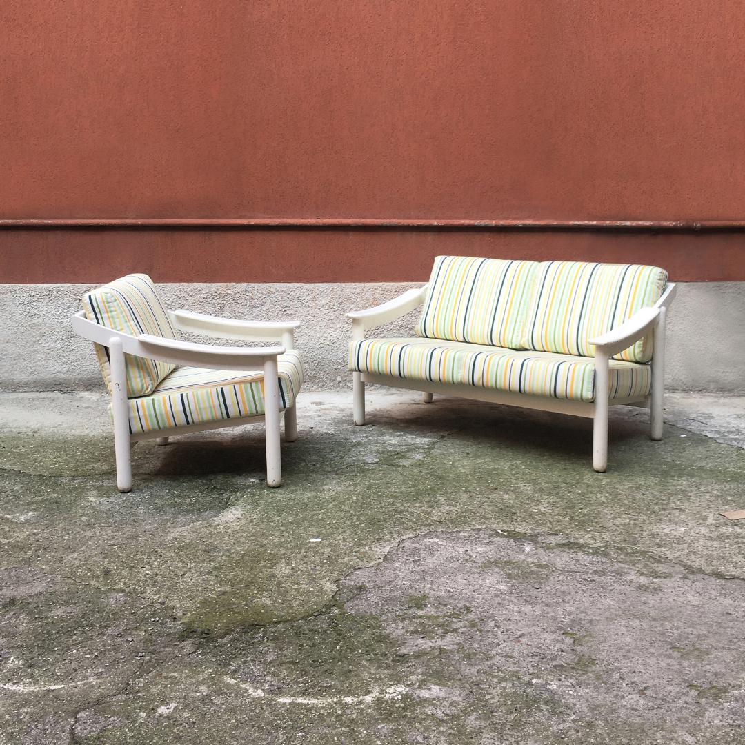 Italian sofa and armchair mod. Loden by Vico Magistretti for Cassina, 1960s. 
Solid wood structure with original white paint, with original fabric on a white background and multicolored striped design of different widths.

Good