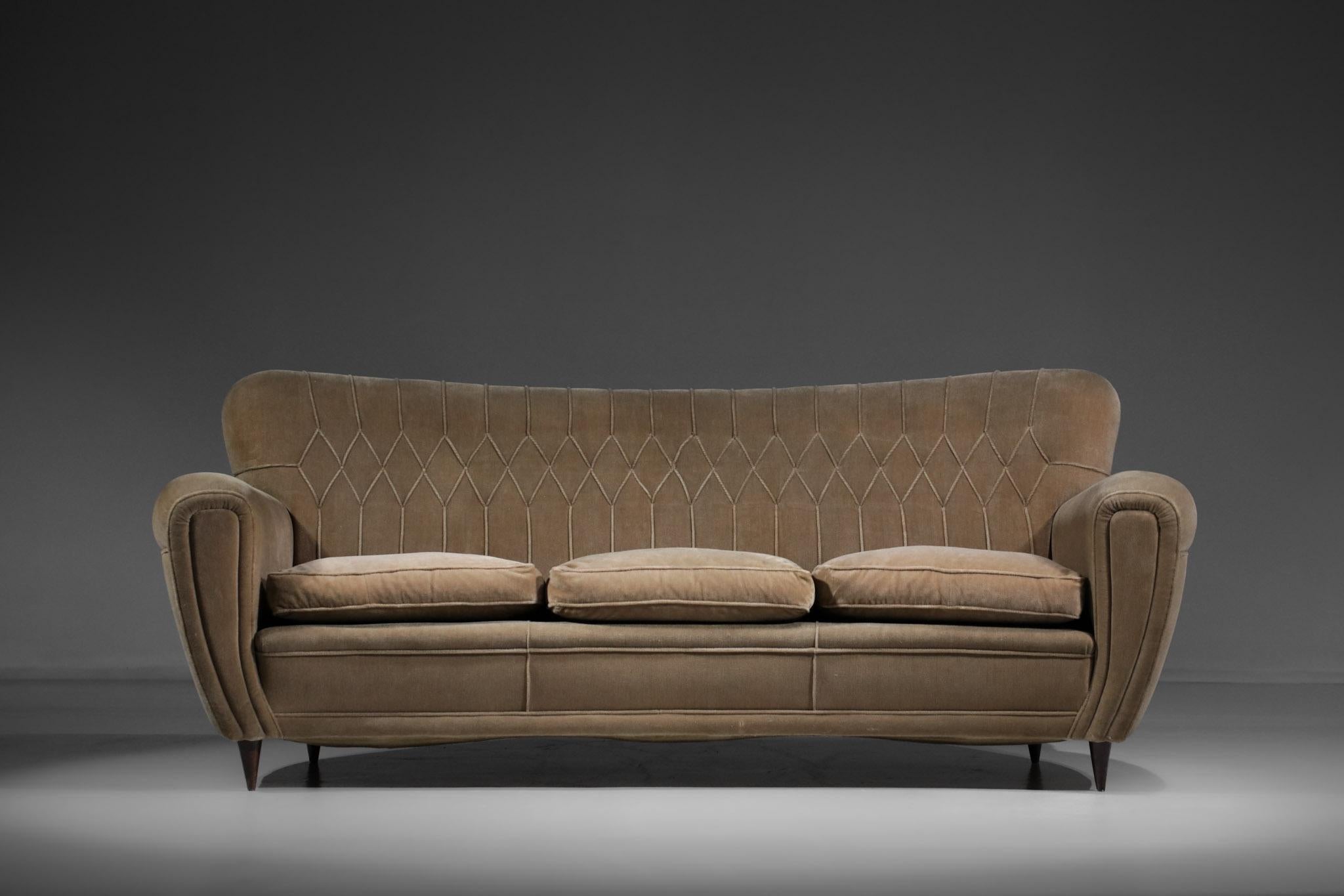 Large Italian sofa from the 1950s attributed to the famous designer Gio Ponti. Three to four seater sofa in light brown alcantara, very nice rounded shape of the backrest and armrests for an enveloping and voluptuous effect typical of Gio Ponti's