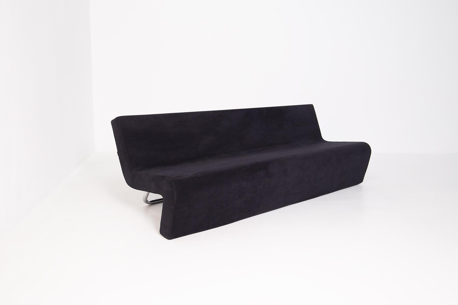 Spectacular sofa produced by MDF Italy in black velvet and steel from the 90s.The sofa of MDF was made with precious materials.The beautiful velvet sofa has a very particular shape, in fact it is formed by a single curved body, where the backrest