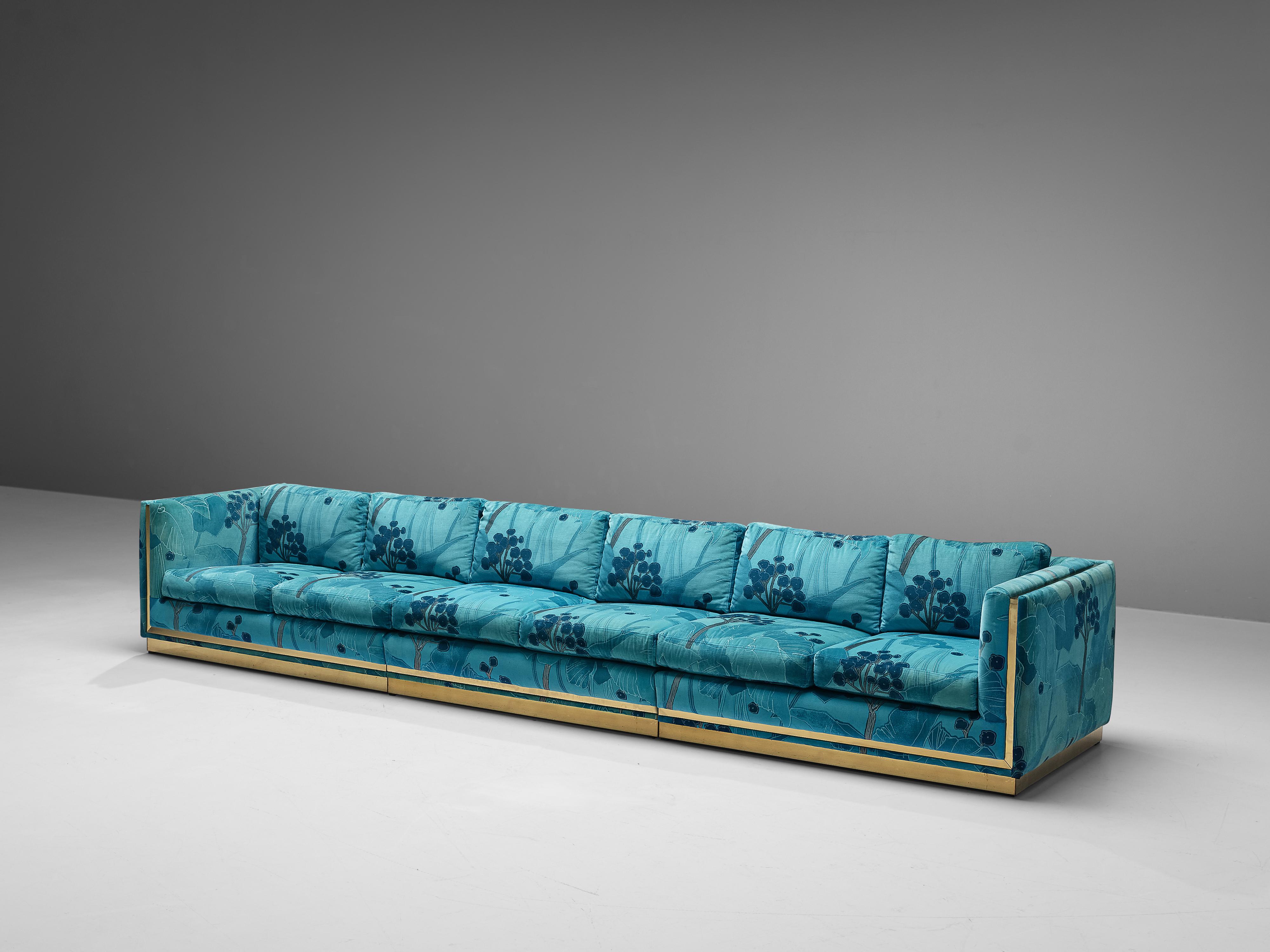 Sofa, fabric and brass, Italy, 1970s 

The upholstery of this gorgeous sofa features illustrative pattern of fauna and flora. The fabric is executed in vibrant colors in various shades of blue and turquoise. This piece of furniture is designed to