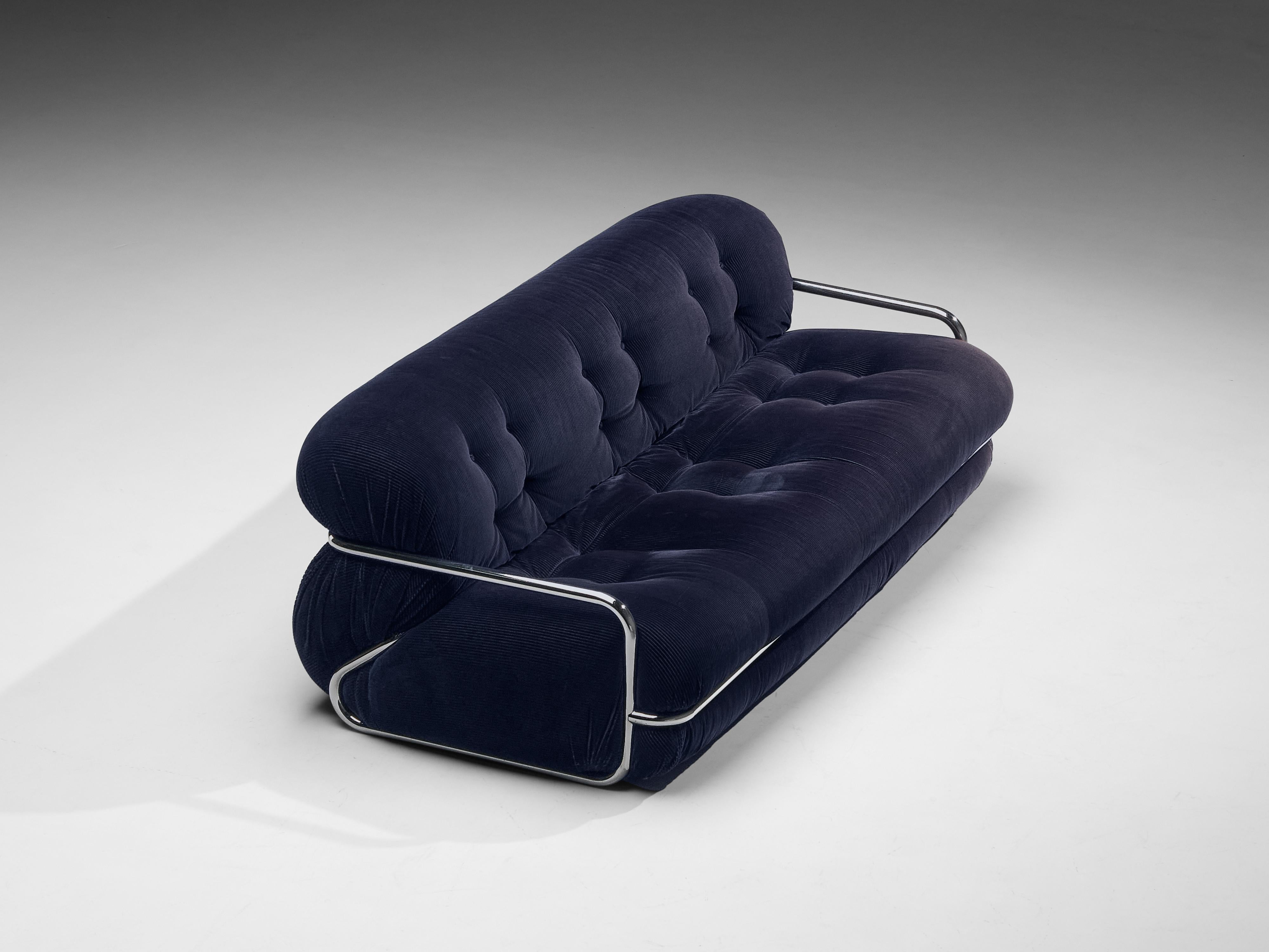Italian sofa, chrome, corduroy, Italy, 1970s

With a strong resemblance to the Afra& Tobia Scarpa’s ‘Soriana’ sofa (1969) this model yet has distinct differences. The bulky seat and backrest upholstered in dark blue corduroy upholstery with tufted