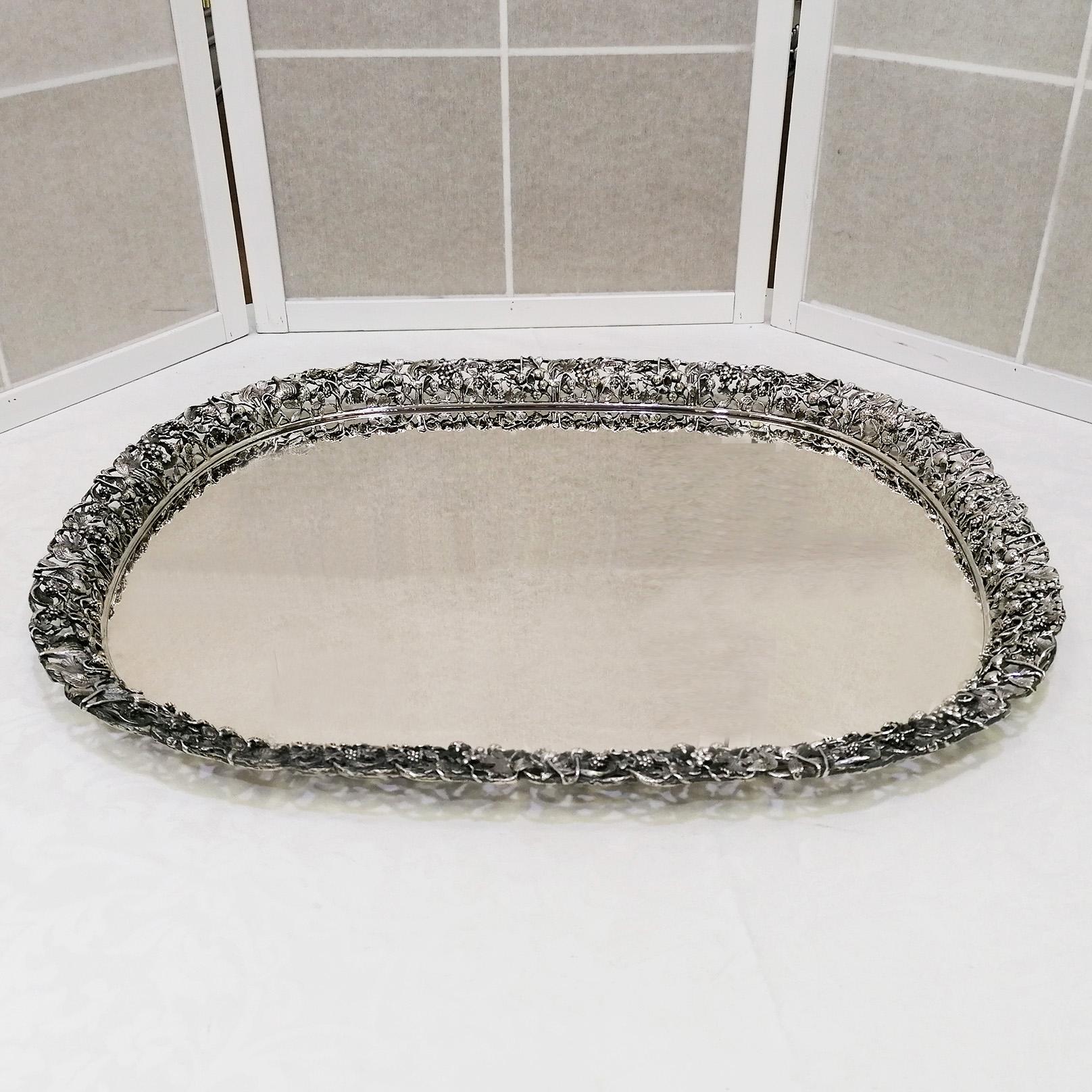 Handmade 800 solid silver tray.
This large tray has a pumice stone polished bottom.
The edge was made with the sector fusion technique and subsequently welded one by one and applied to the bottom of the tray.
The important edge reproduces many types