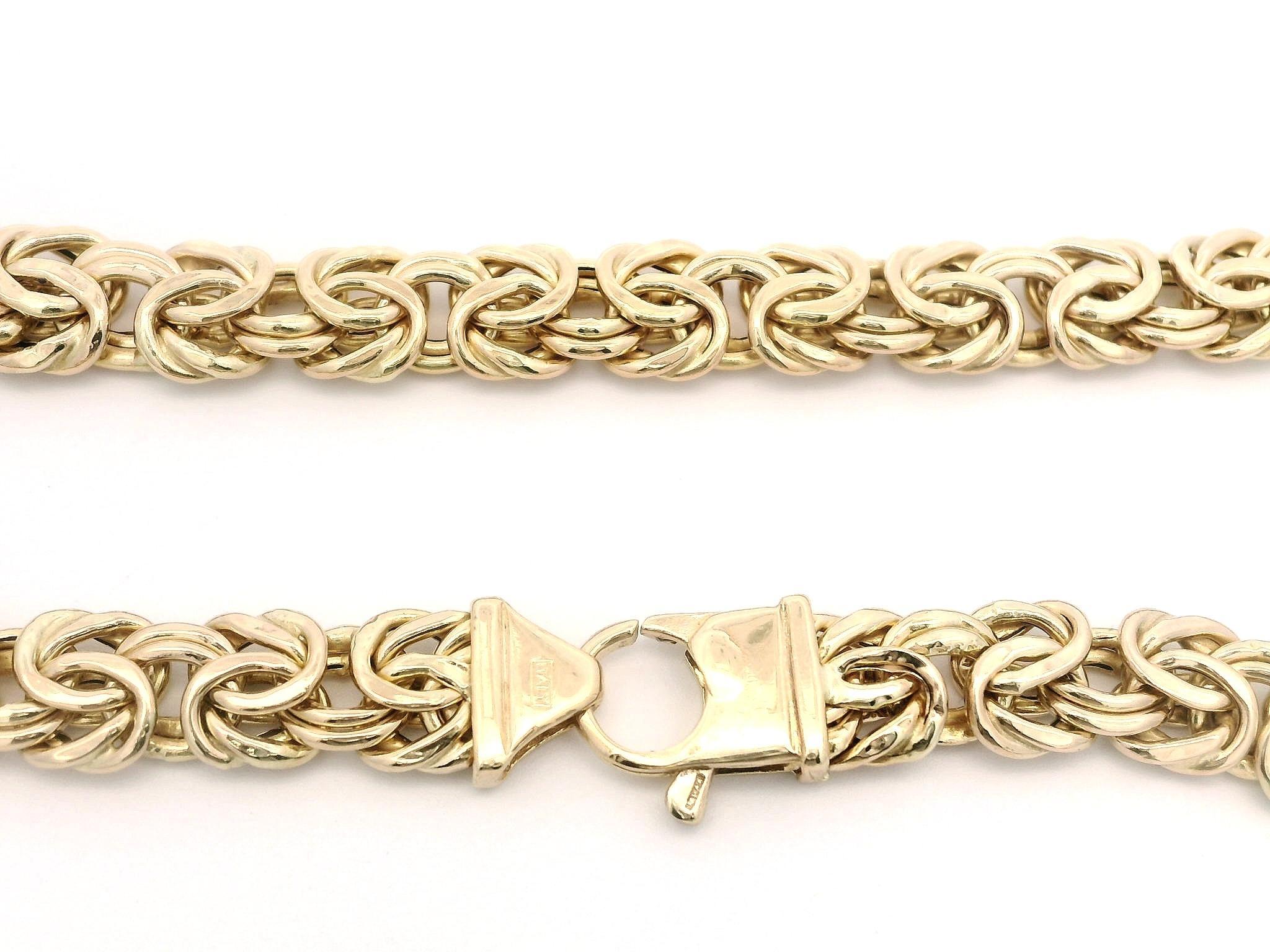 Material: Solid 14k Yellow Gold
Weight: 17.65 Grams
Chain Type: Byzantine Link
Chain Length: 17.5 Inches
Chain Thickness:	4.9mm (at the center of the necklace)
Chain width: Graduated from 7.2mm (0.28