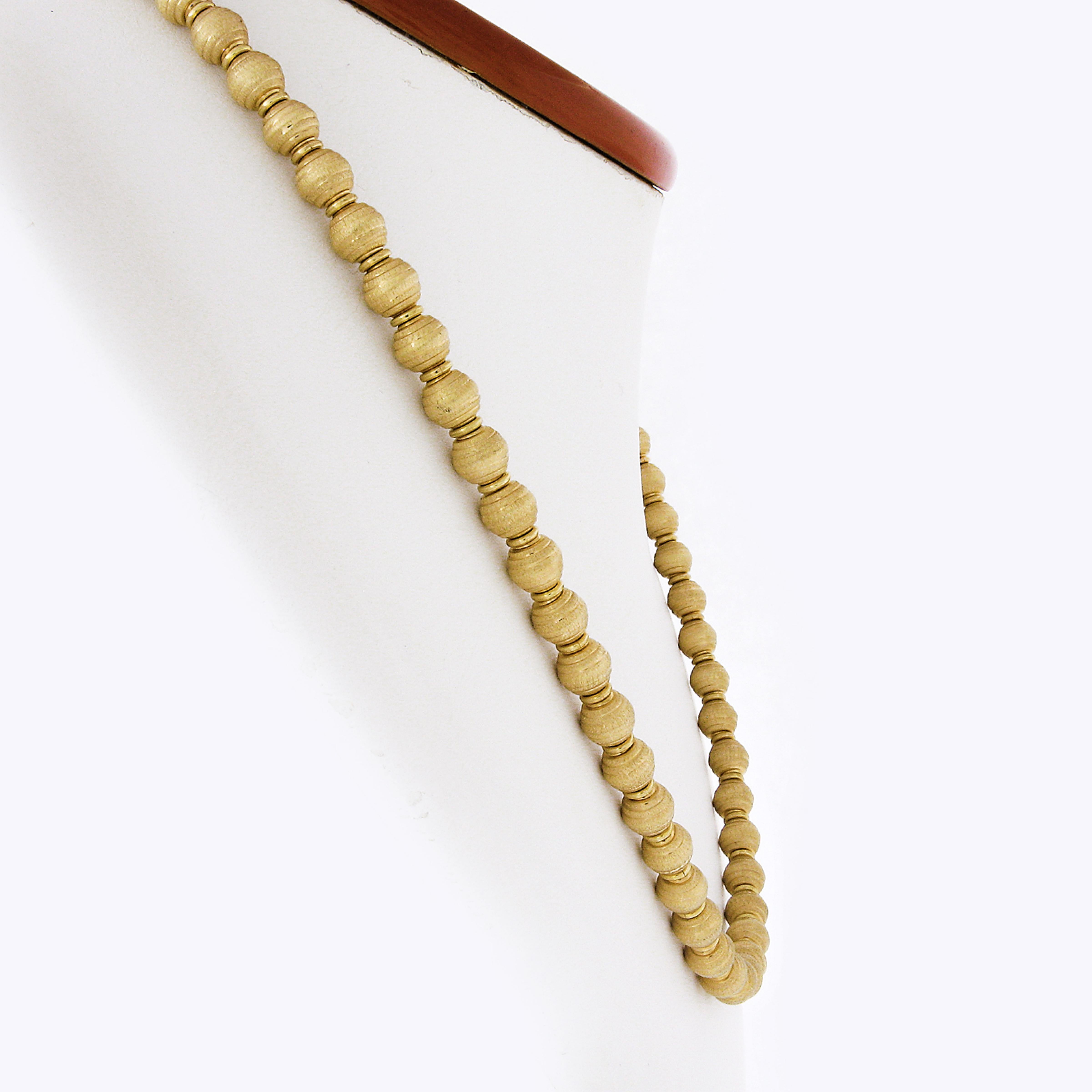 Here we have an absolutely gorgeous necklace that was crafted in Italy from solid 18k yellow gold. This very well made piece features 6mm ball beads that are completely covered with a lovely brushed finish throughout. The brushed texture finish