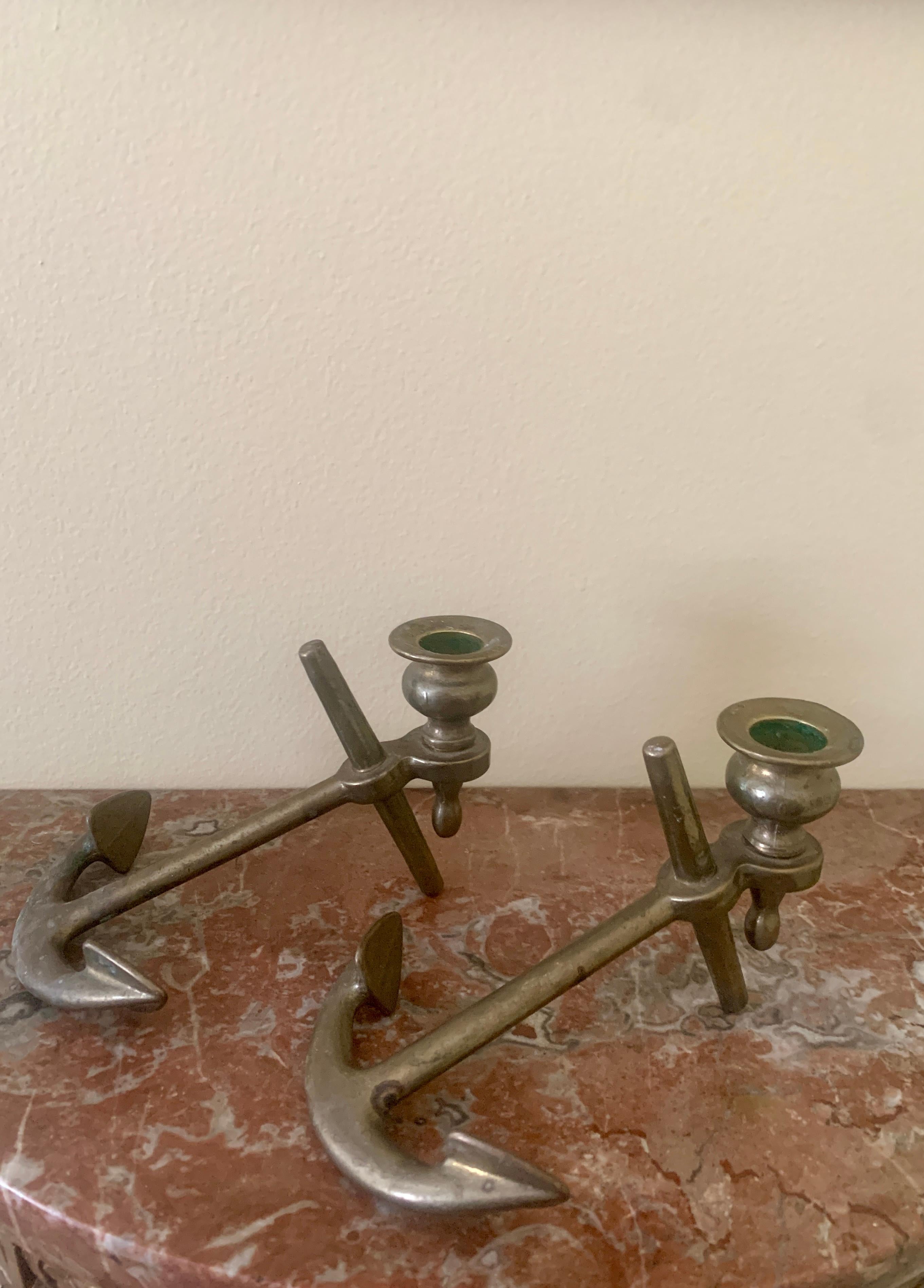 A charming pair of cast solid brass anchor candlestick holders. Perfect for your Nantucket, Cape, or Hamptons home! 

USA, Mid-20th Century

Measures: 6