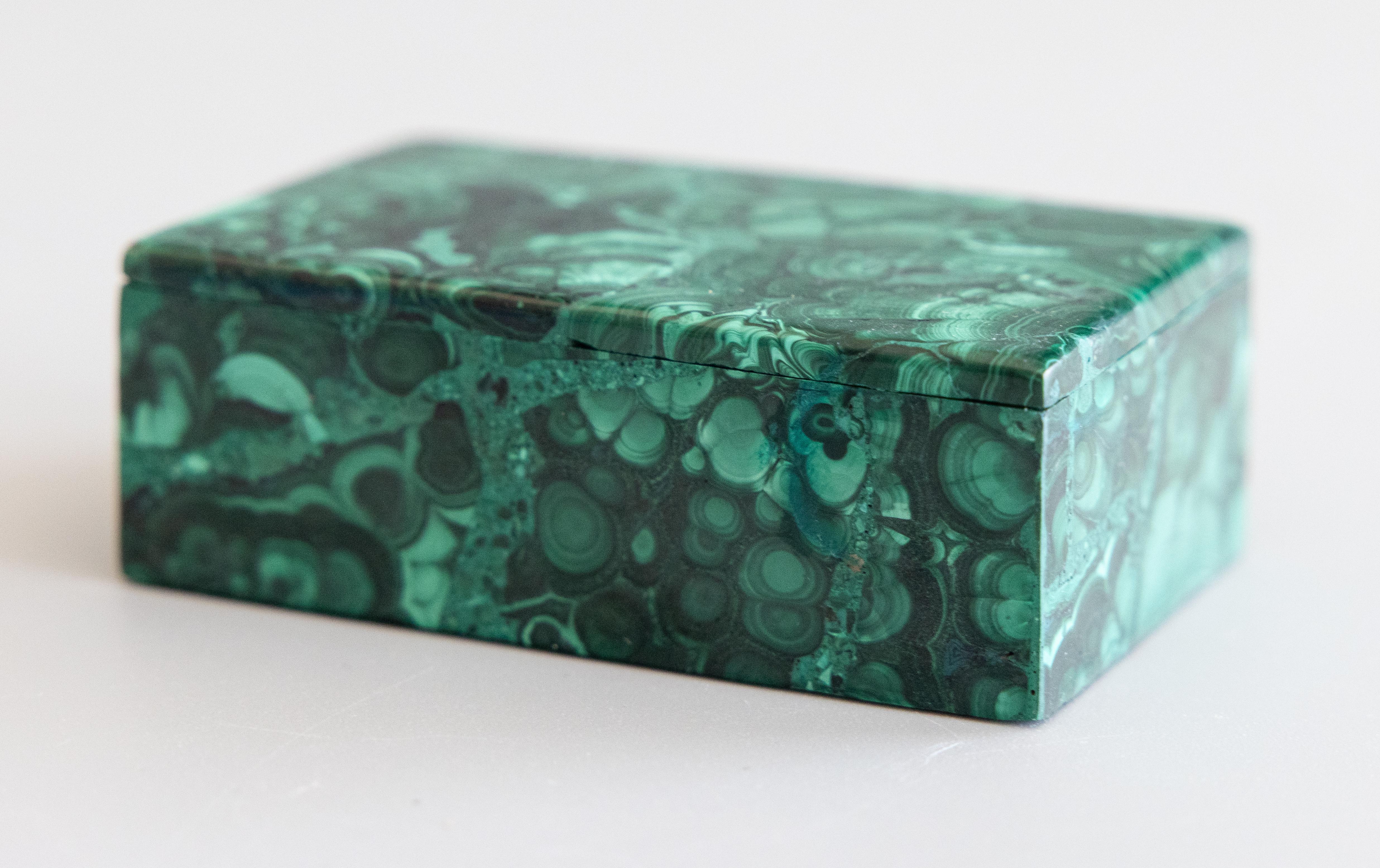 A stylish Italian natural malachite rectangular lidded box with lovely patterns in brilliant emerald green. Fine gemstone quality and craftsmanship. Perfect as a jewelry or trinket box and would make a wonderful gift. 

Dimensions
3.5ʺW × 2.2ʺD ×