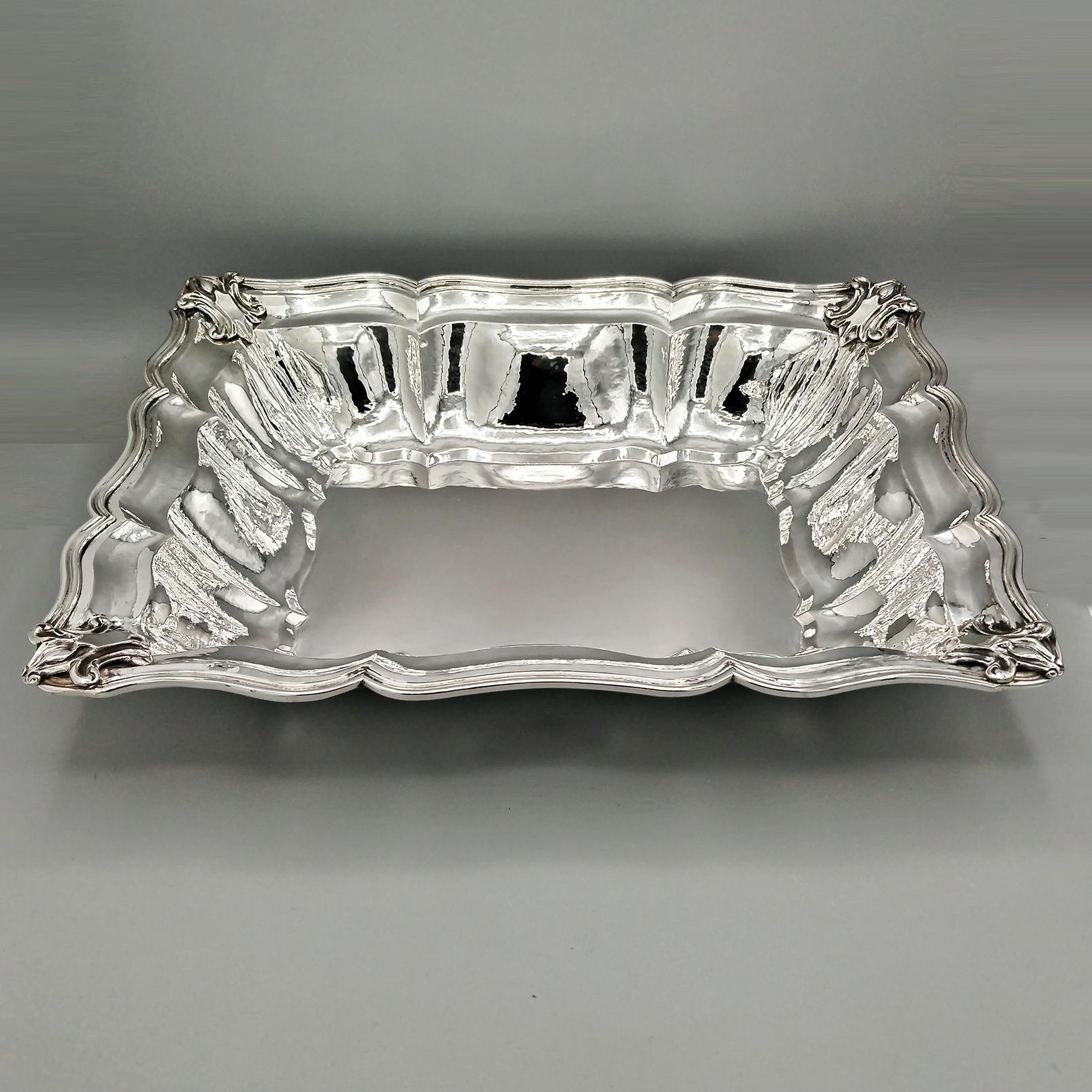 Rectangular baroque centerpiece in solid 800 silver, completely handmade.
The centerpiece was made starting from a raw sheet of silver, padded and shaped to give it a rectangular shape.
On the raised part, grooves have been embossed, typical of the