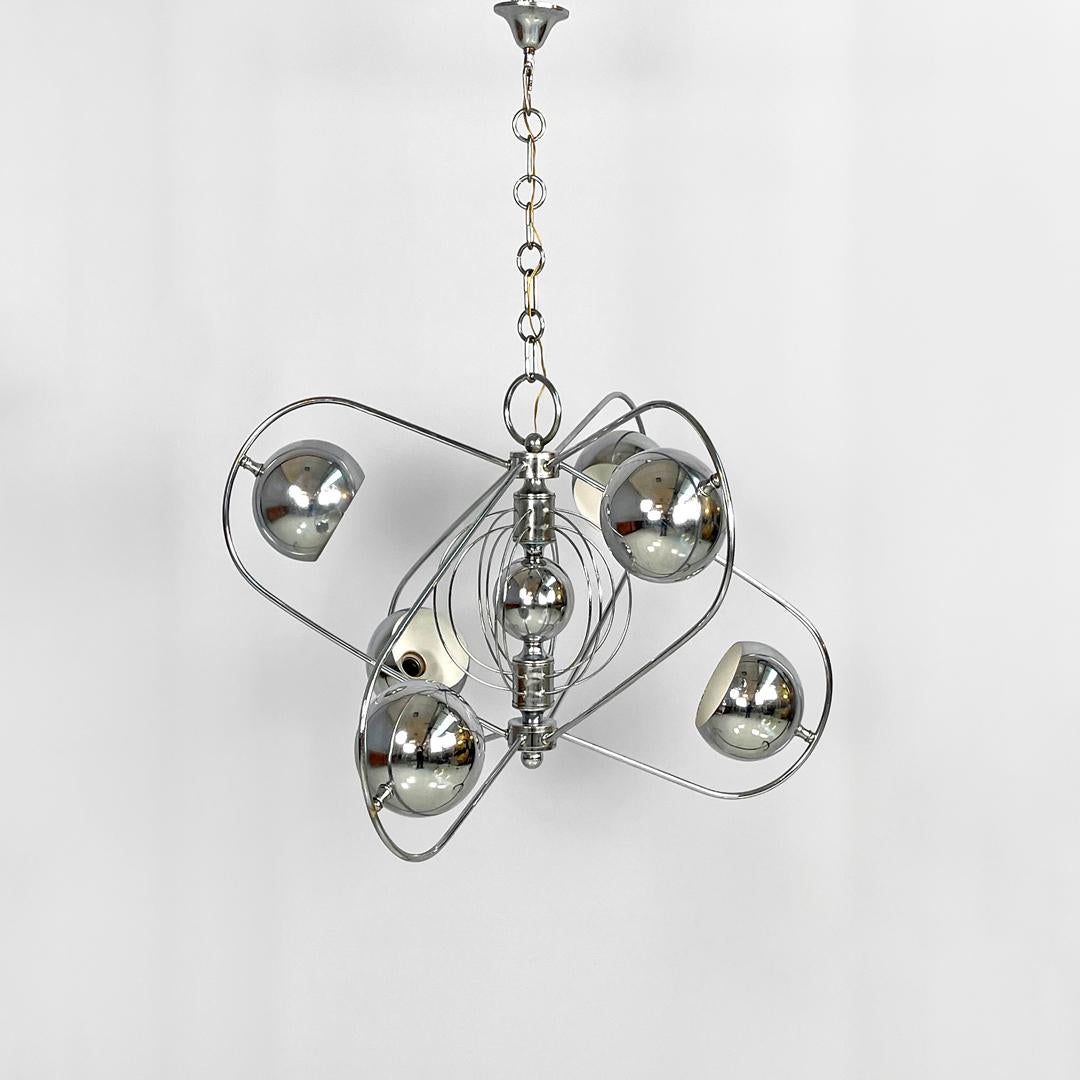 Italian Space Age spheres atom shaped ceiling lamp in chromed metal, 1970s
Chandelier that recalls the shape of an atom in chromed steel, Space Age style. The main structure is composed of curved metal rod arms with six cut spheres at the ends which