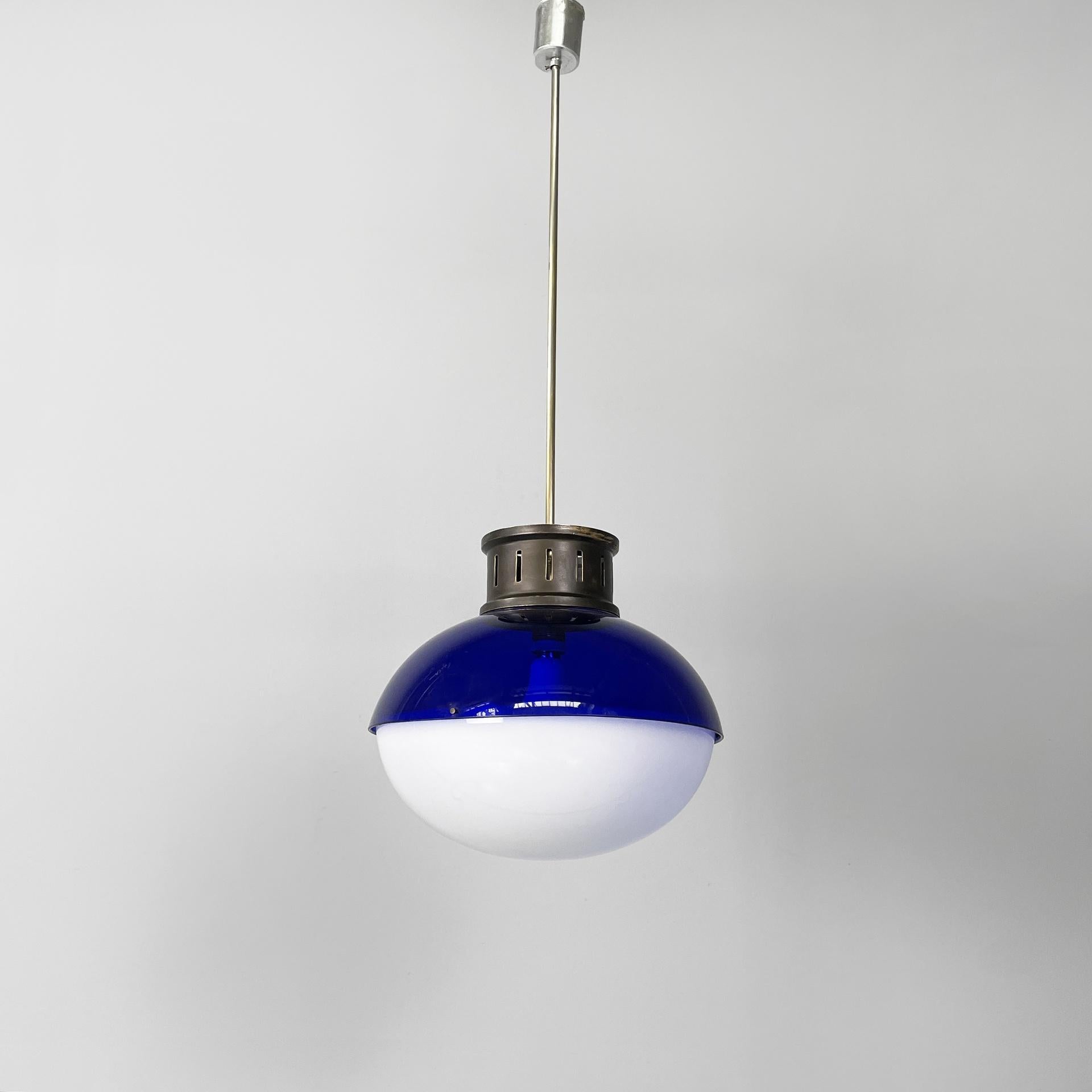Italian Space Age chandelier in blue and white plexiglass, 1970s 
Chandelier or ceiling lamp with round diffuser, composed of two semi-spherical parts in blue plexiglass and white plexiglass. The two parts are joined by brass screws. In the upper