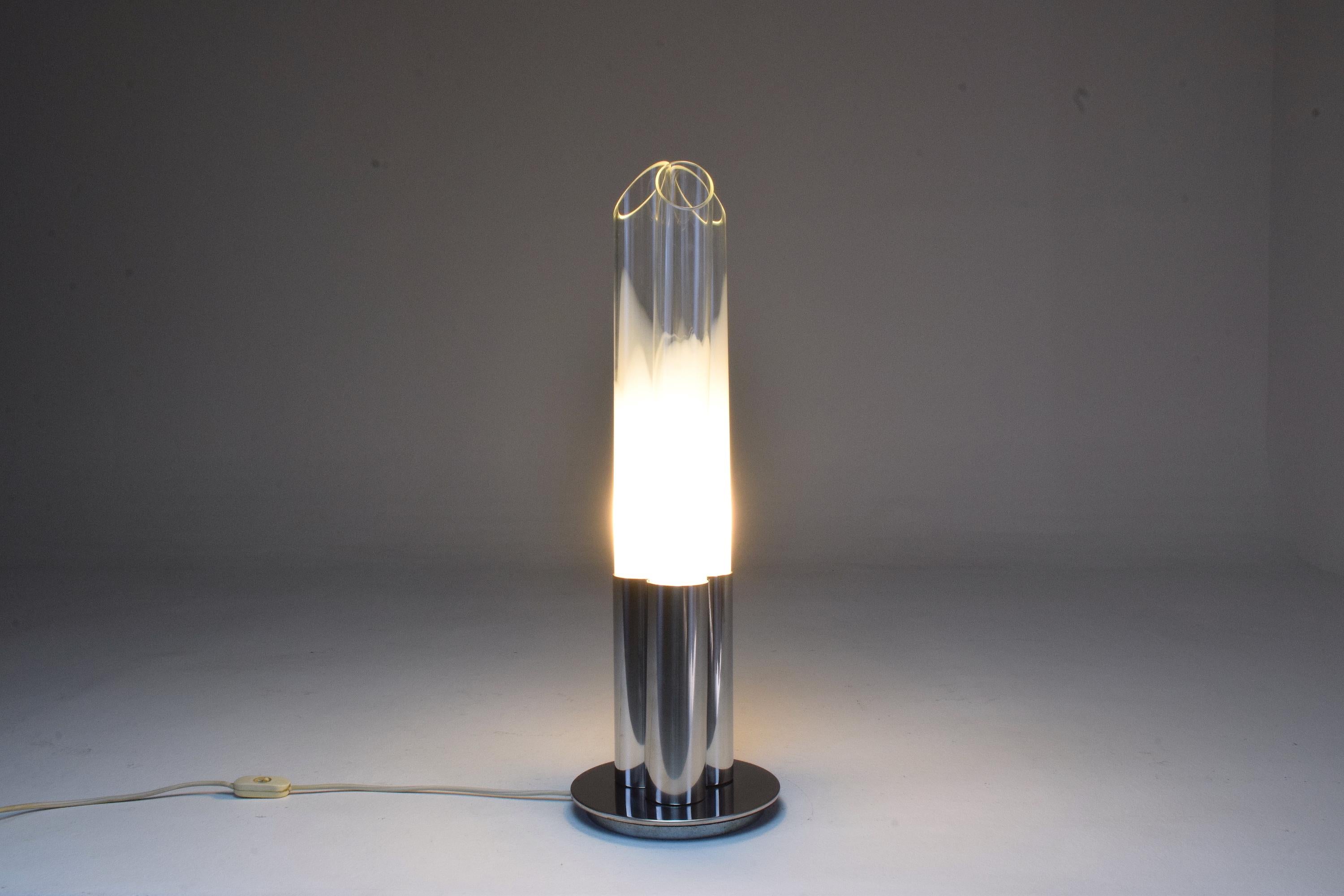 A 20th century table accent lamp designed by Goffredo Reggiani in the 1970s composed of a chrome circular base with three tube light-pipes in a gradient glass, milk glass shades. 
The beautiful glass shades are in their original condition. 
Italy,