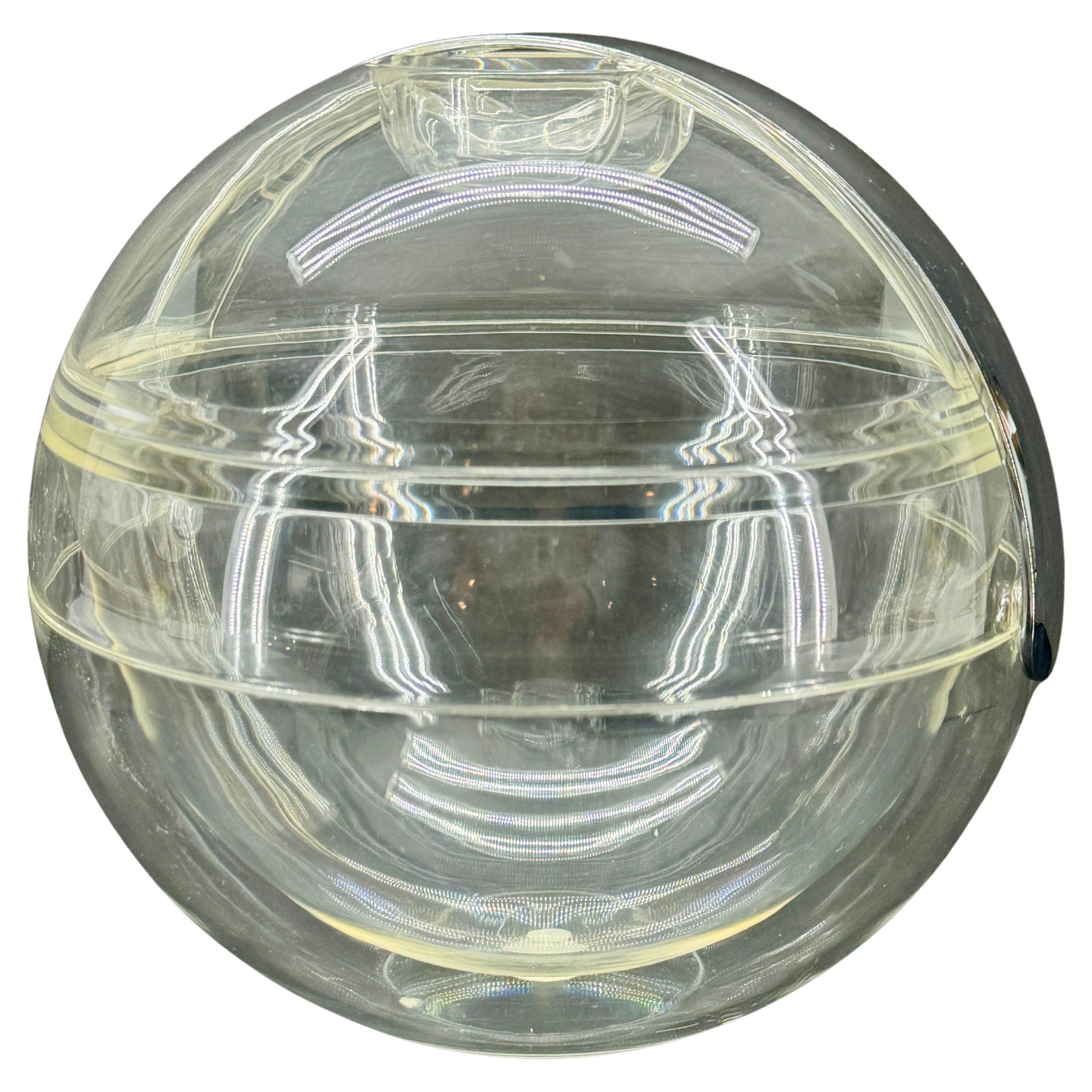 Clear acrylic glass ice bucket by Pablo Tilche for Guzzini Italy circa 1970s. This piece certainly makes a wonderful statement on a bar or bar cart. This piece has an attribution mark, Made in Italy.
