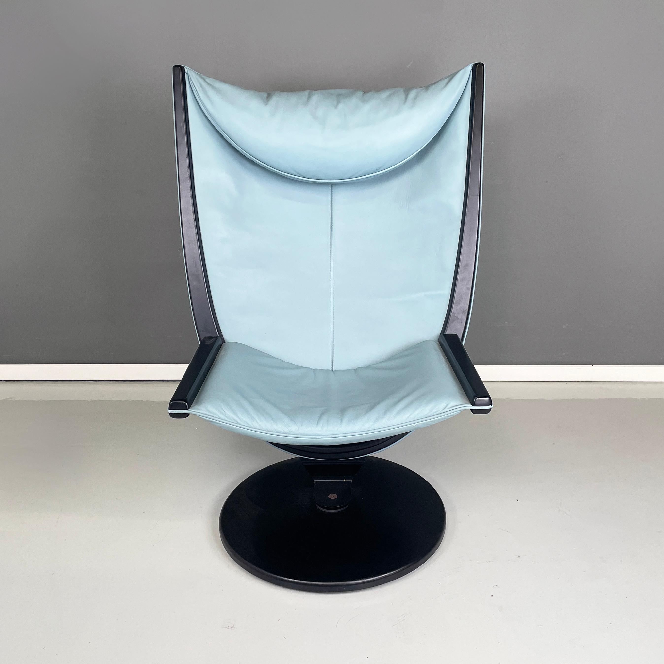 Italian space age modern light blue leather black wood Armchair by Westnofa, 1980s
Armchair with round base in black painted wood. The armchair has back and seat, padded and covered on the front in tiffany blue leather and on the back in black