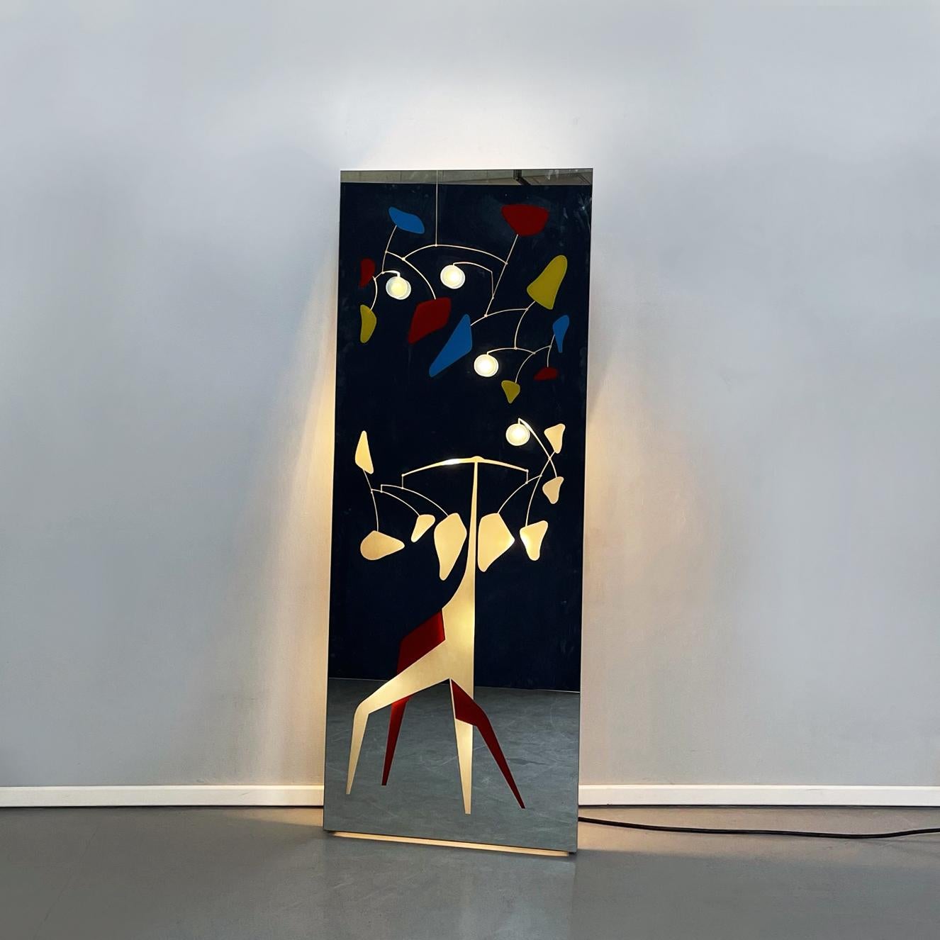 Italian space age Rectangular backlit floor mirror with red, blue and yellow fantasy, 1980s
Rectangular floor mirror. On the front of the mirror there is a pattern composed of irregular geometric figures, that recall the sculptures of Alexander