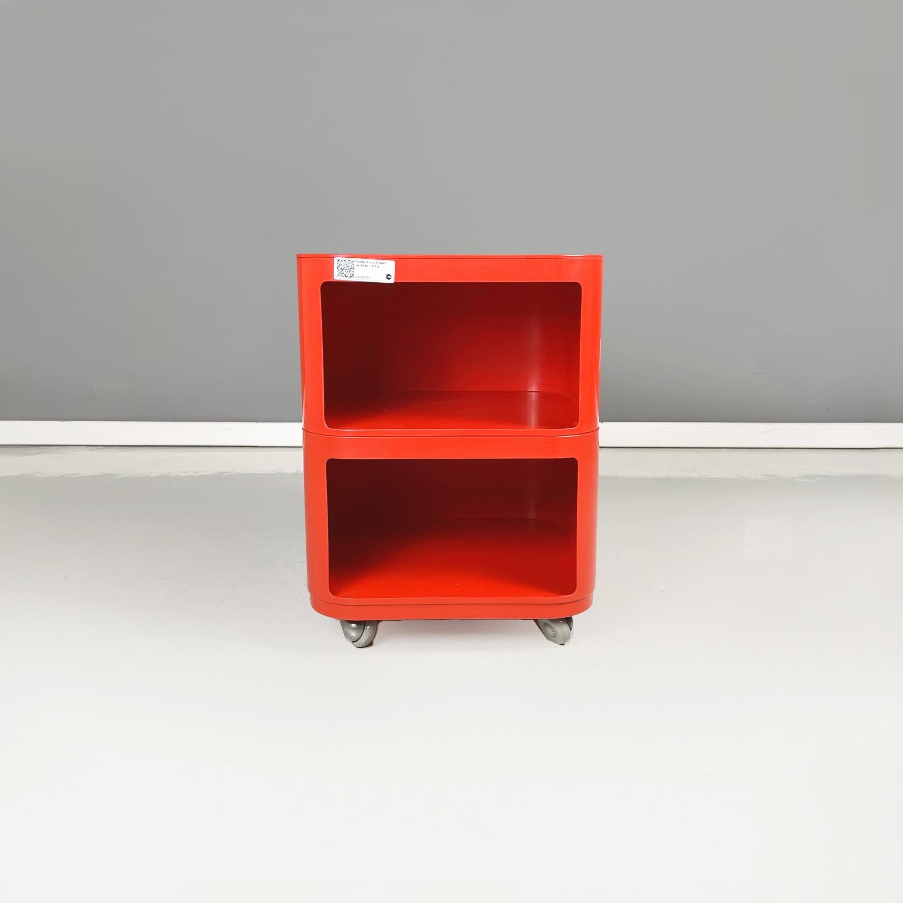 Italian Space Age Red plastic Modular chest of drawers by Anna Castelli for Kartell, 1970s
Modular chest of drawers with square base and rounded corners in red plastic. The chest of drawers has two open compartments. Wheels at the base. It can also