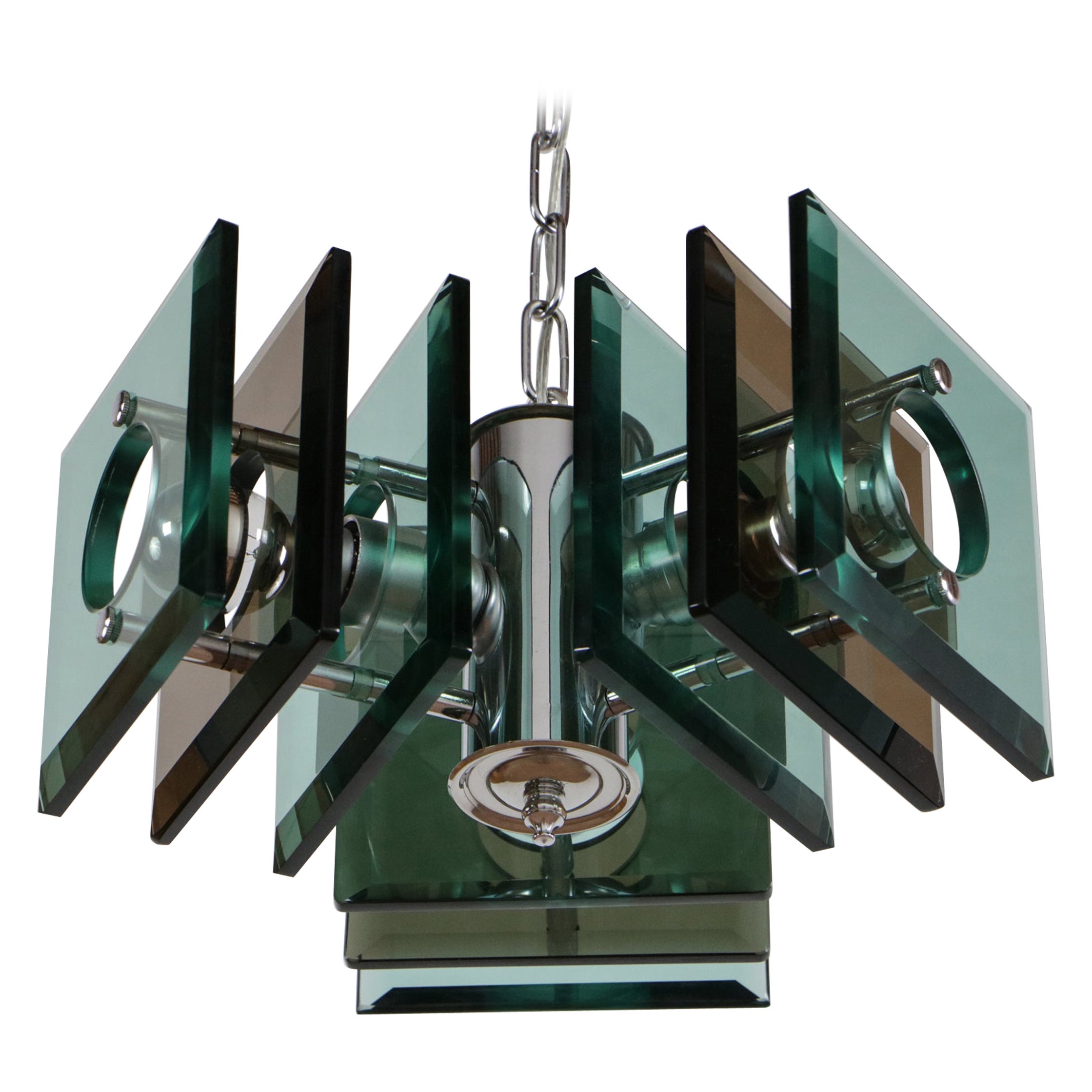 Gorgeous Italian chandelier from the 1970s, Space Age period by Lupi Cristal Luxor. This lamp features chromed brass, chromed steel, crystal, and 3 E27 bulbs. This piece is an excellent example of the Italian design of the 1970s, executed in